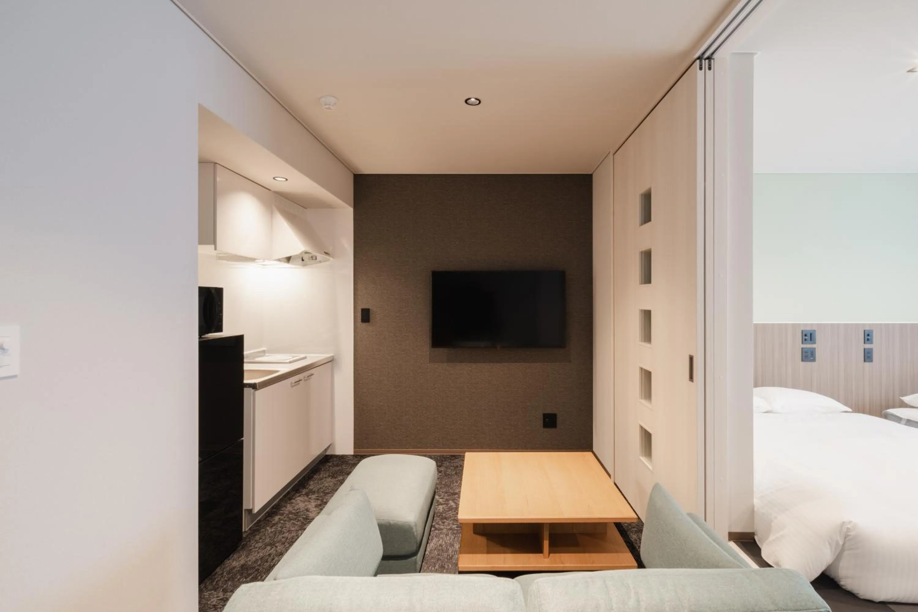 Kitchen or kitchenette, Bed in Hotel Ninestates Kagoshima