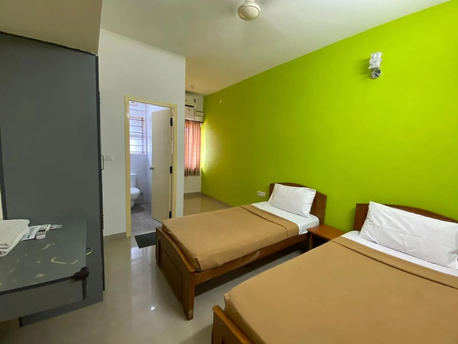 Bed in ThulasiRams Service Apartments