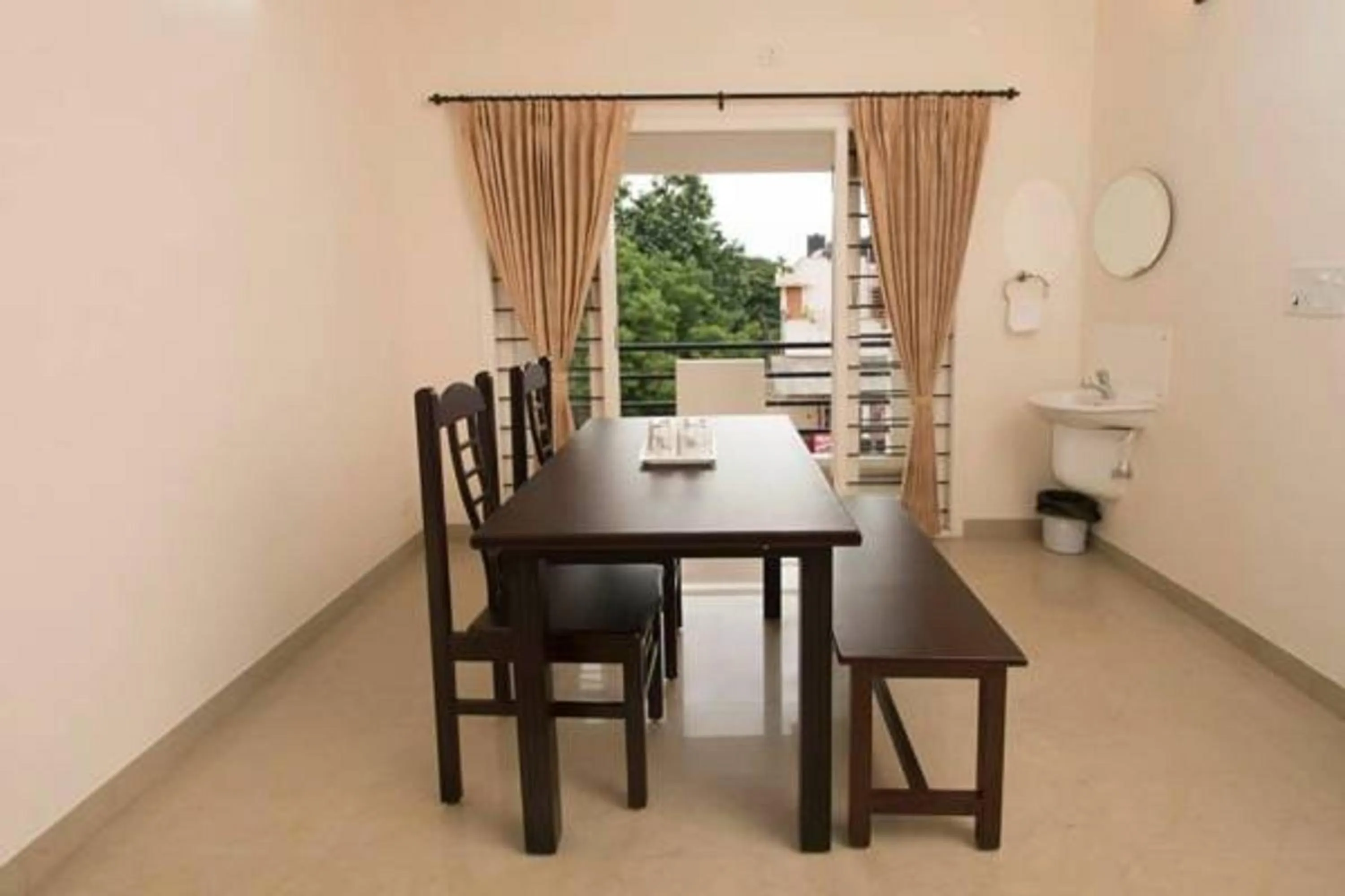 Dining area in ThulasiRams Service Apartments