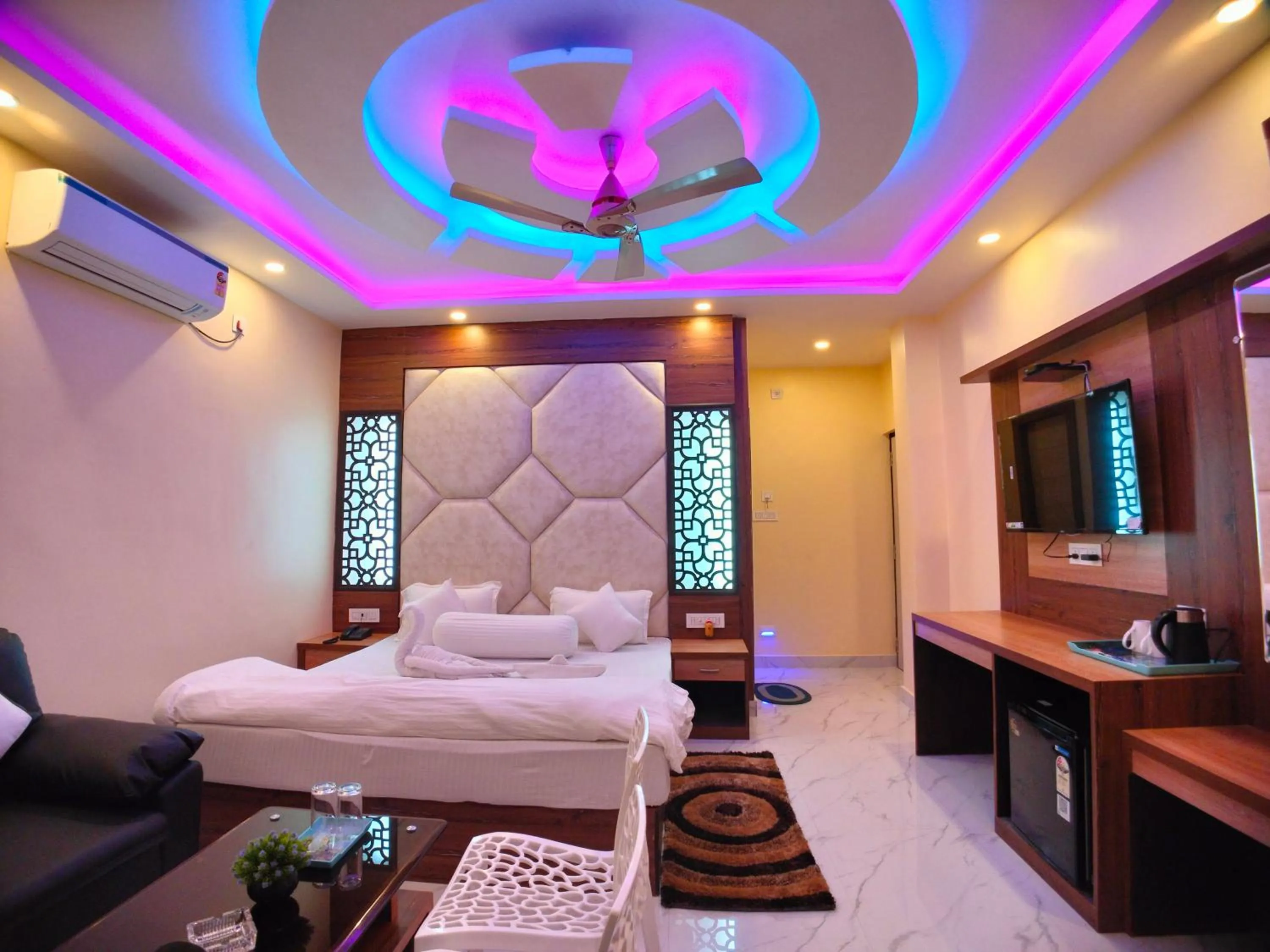 Bed in The Triton Beach Resort