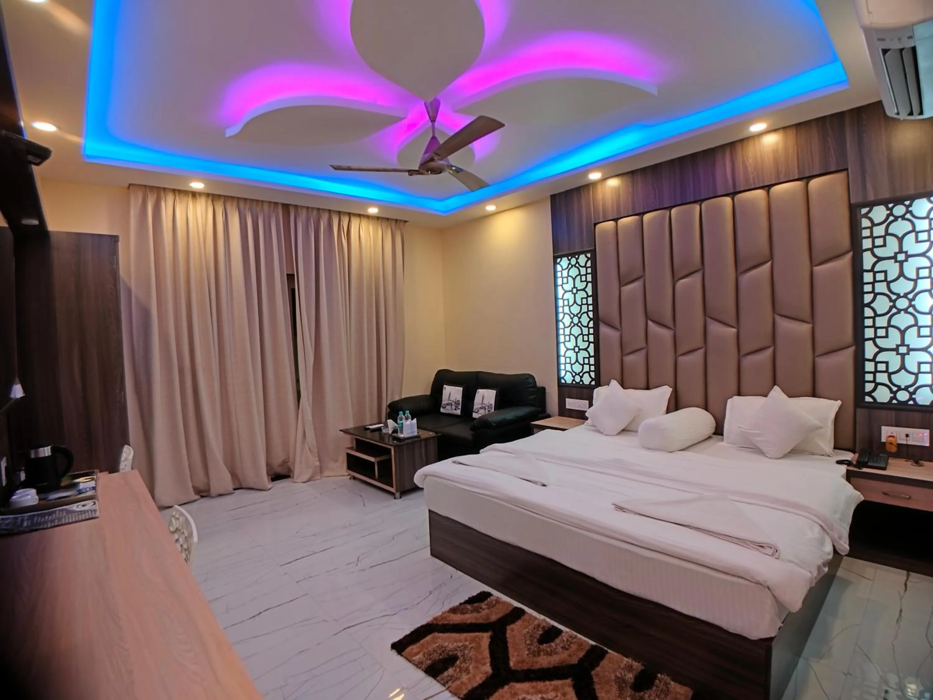 Photo of the whole room, Bed in The Triton Beach Resort