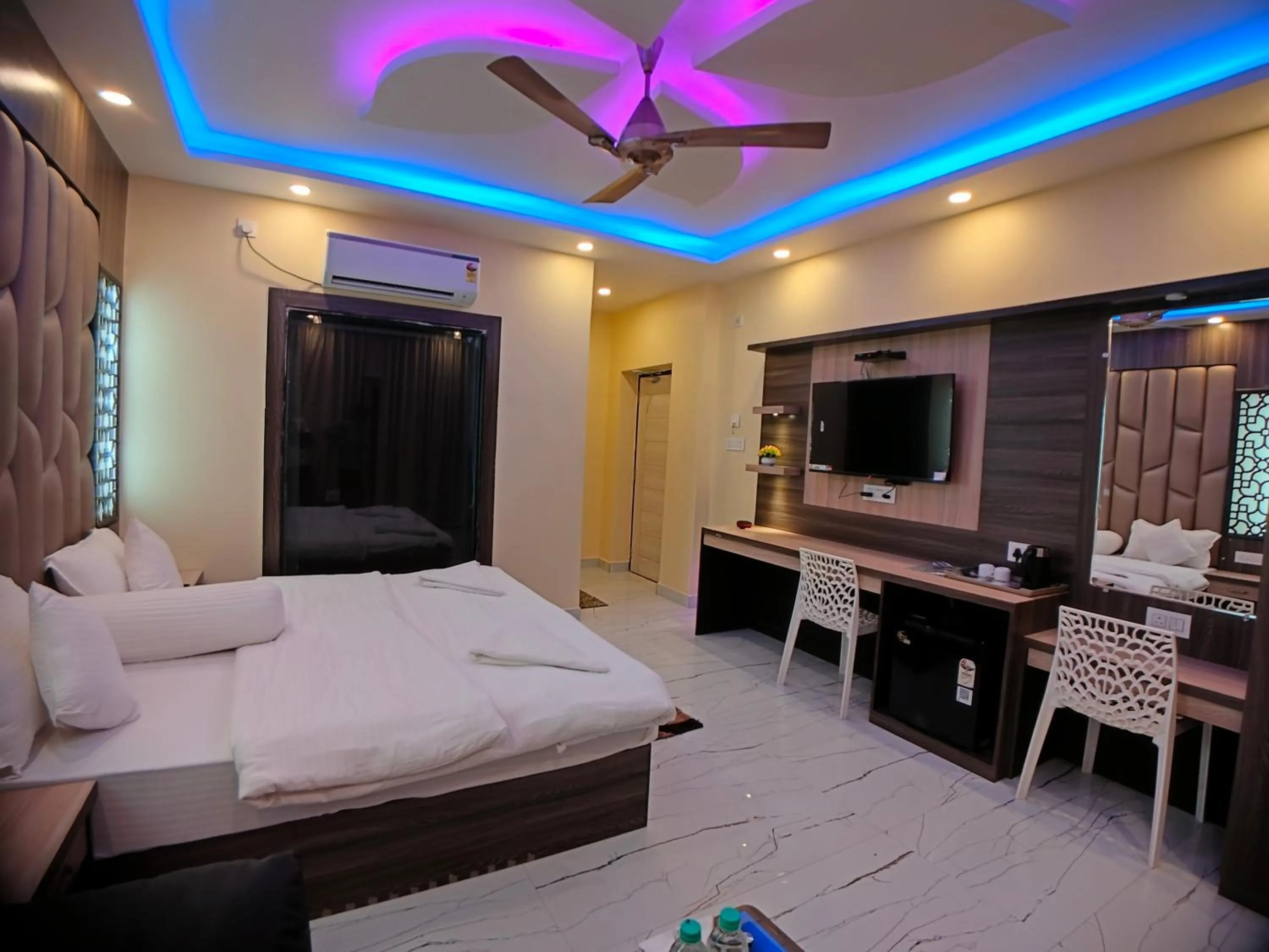 Bed in The Triton Beach Resort