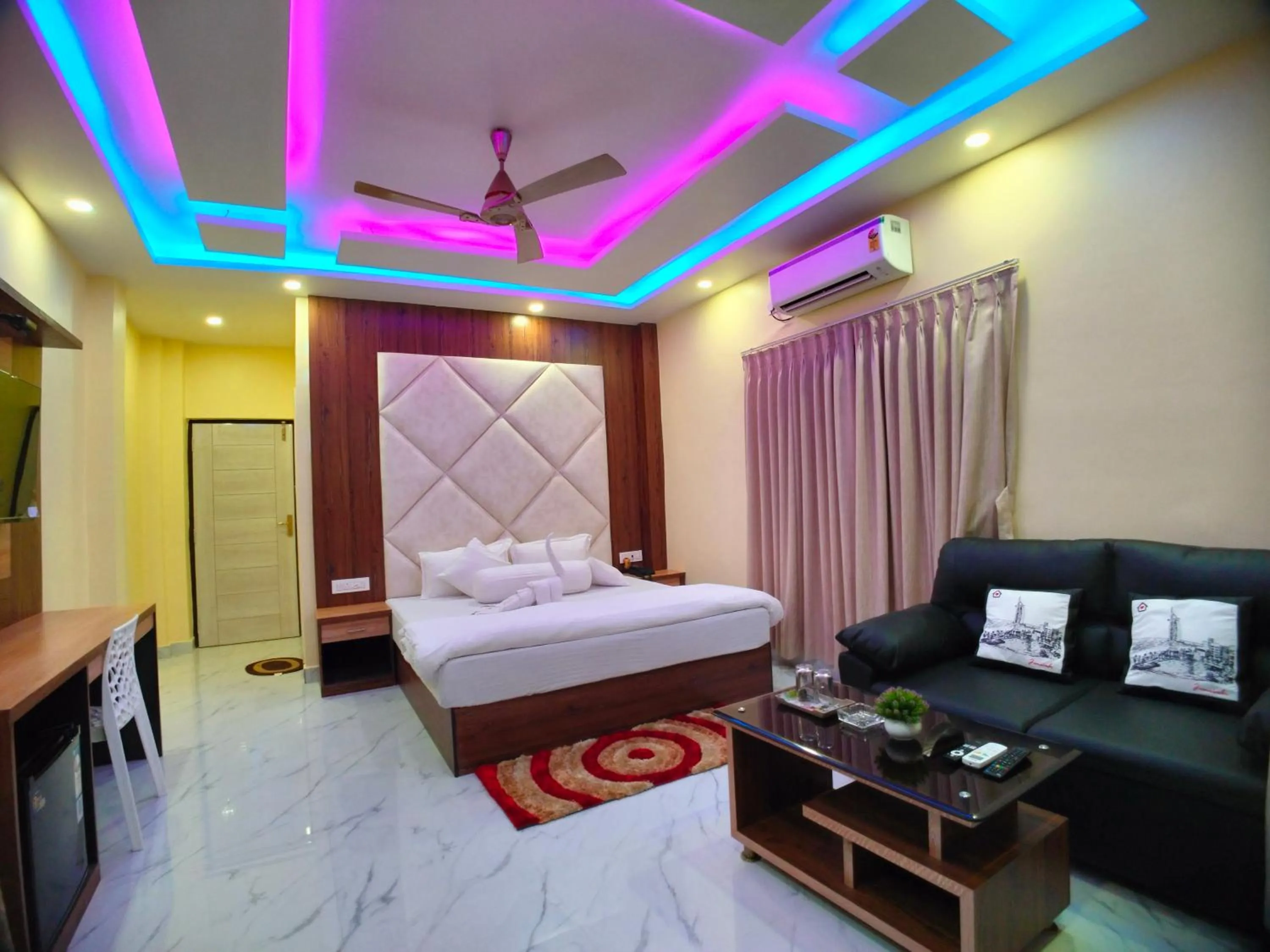 Bed in The Triton Beach Resort