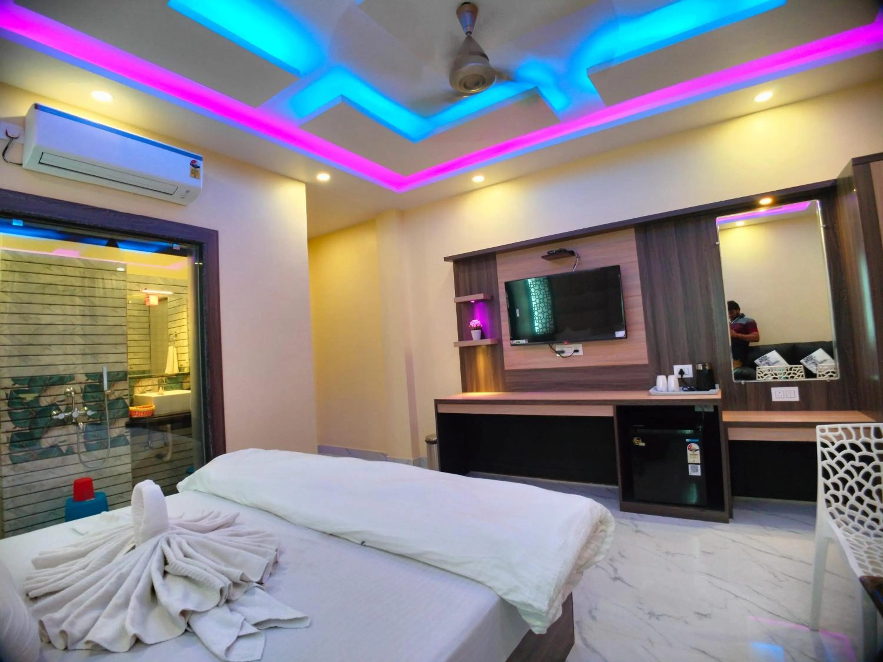 Bed in The Triton Beach Resort