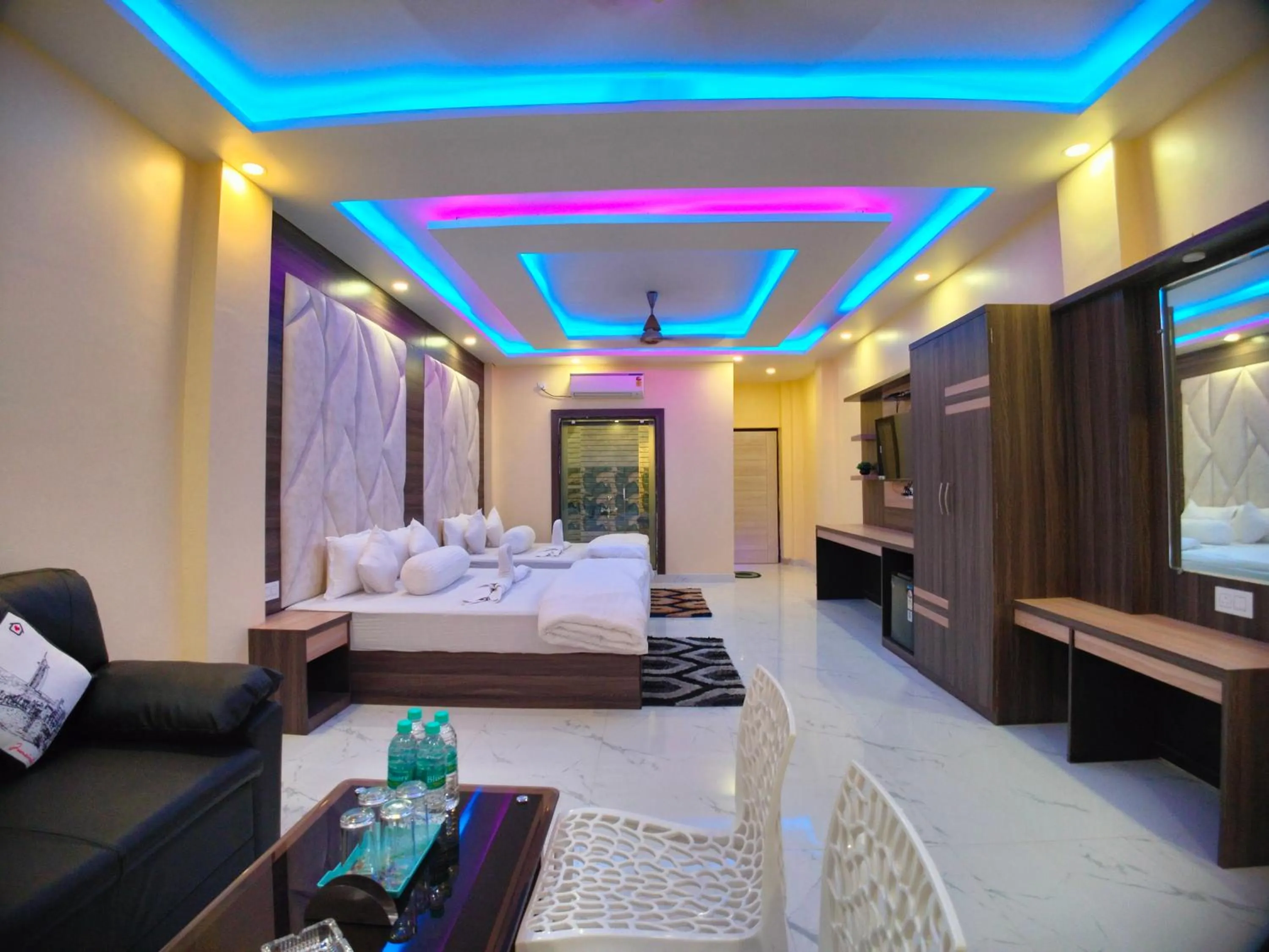 Bed in The Triton Beach Resort