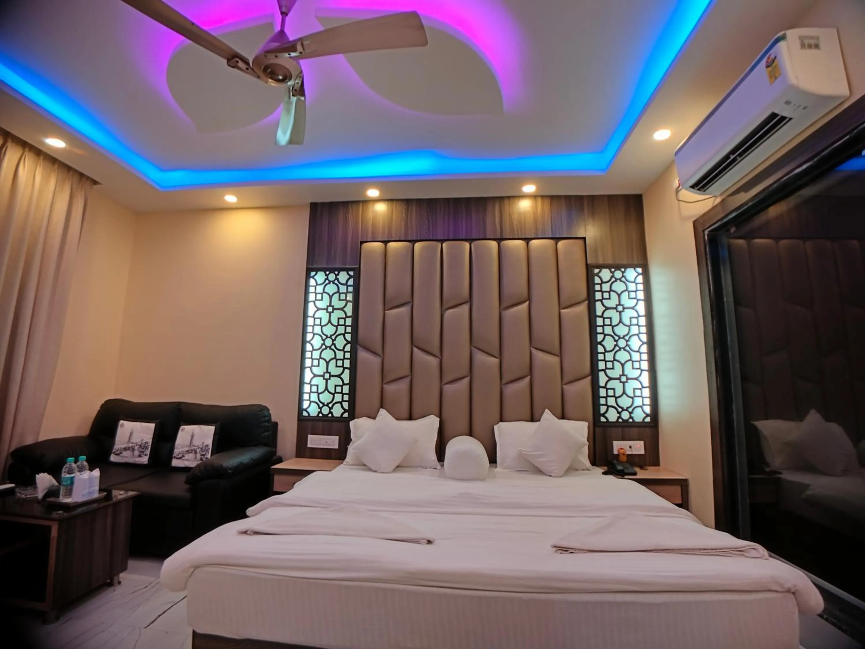 Bed in The Triton Beach Resort