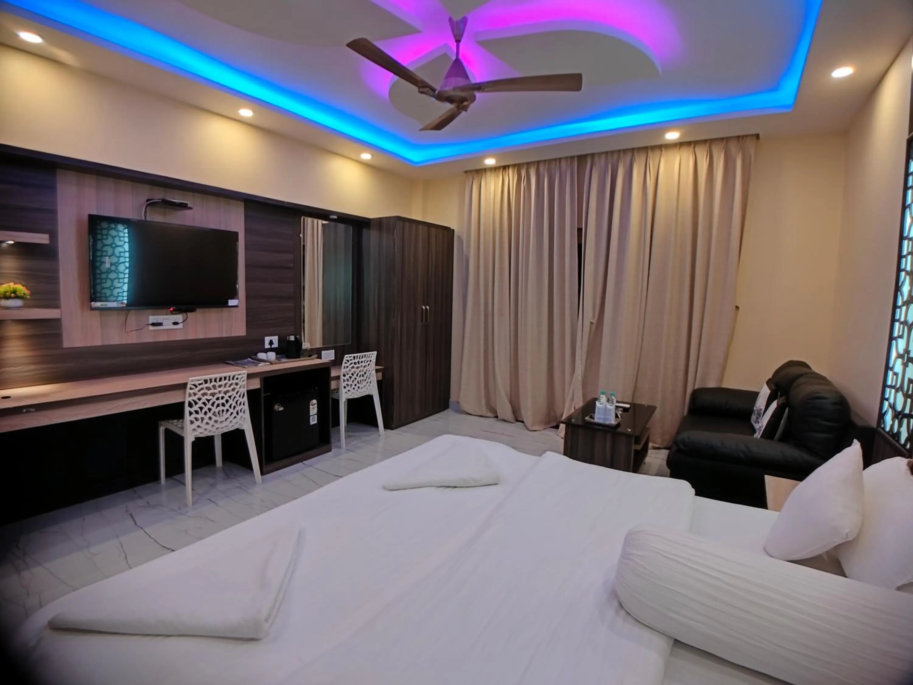 Bed in The Triton Beach Resort