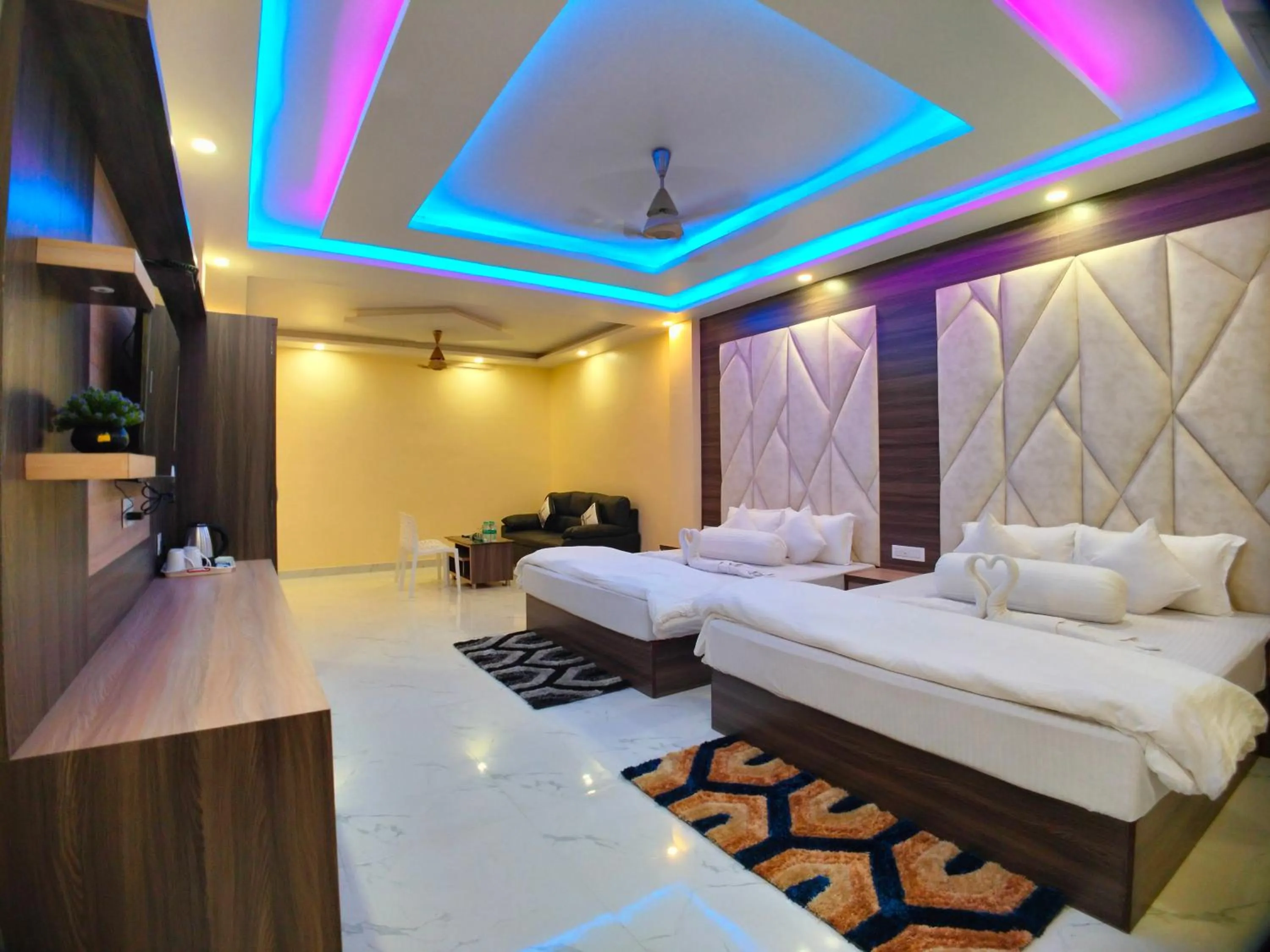 Bed in The Triton Beach Resort