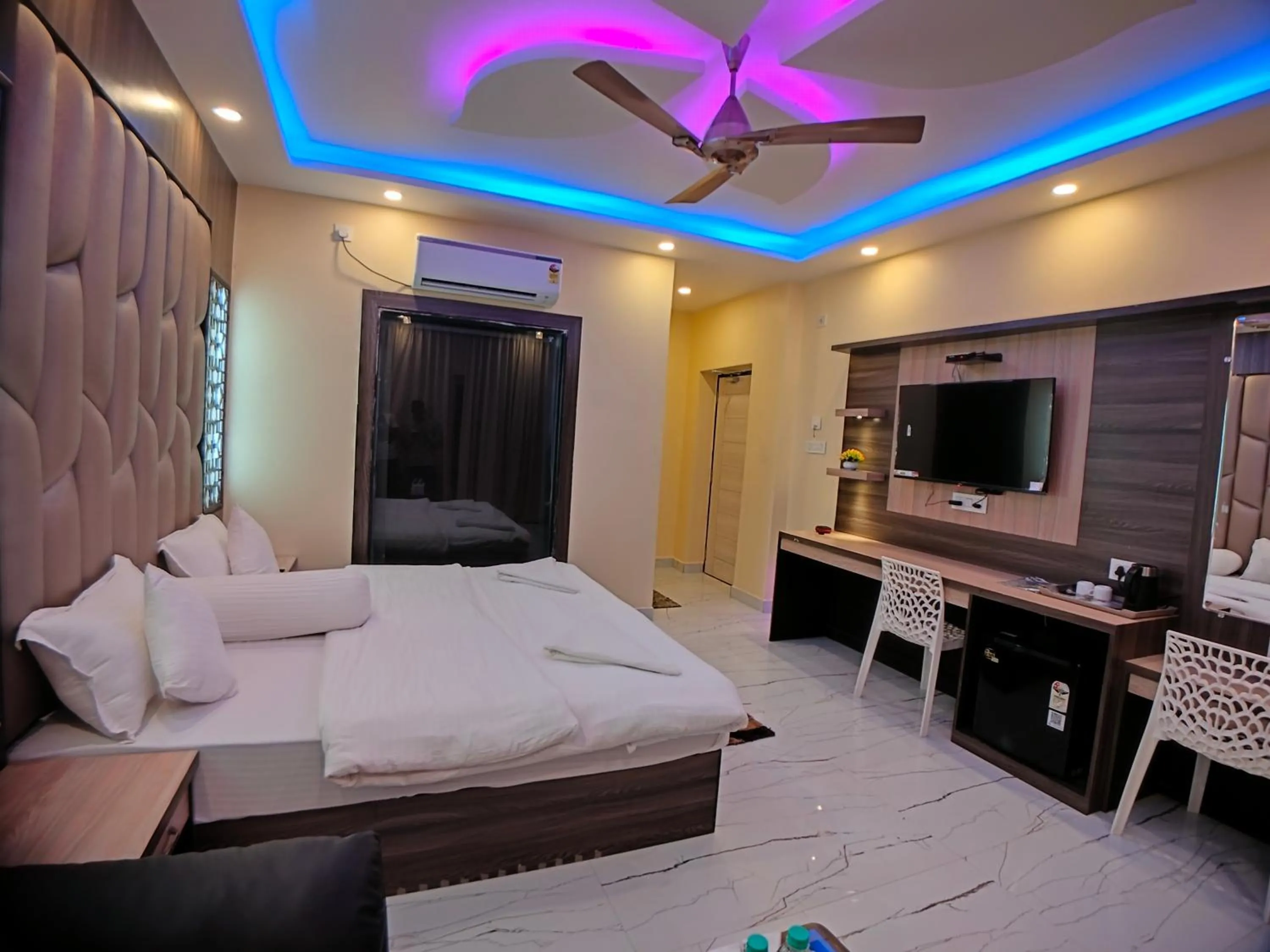 Bed in The Triton Beach Resort