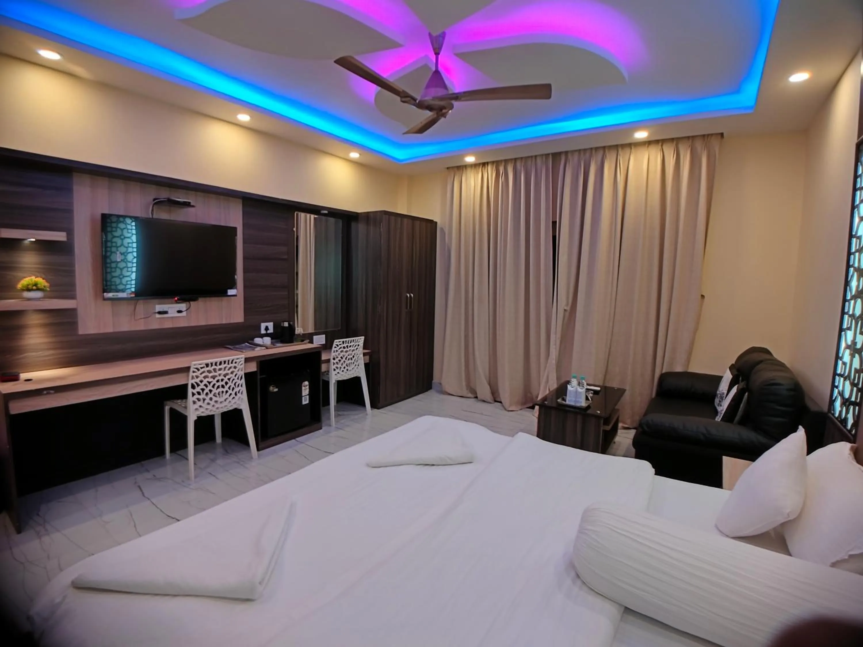 Bed in The Triton Beach Resort