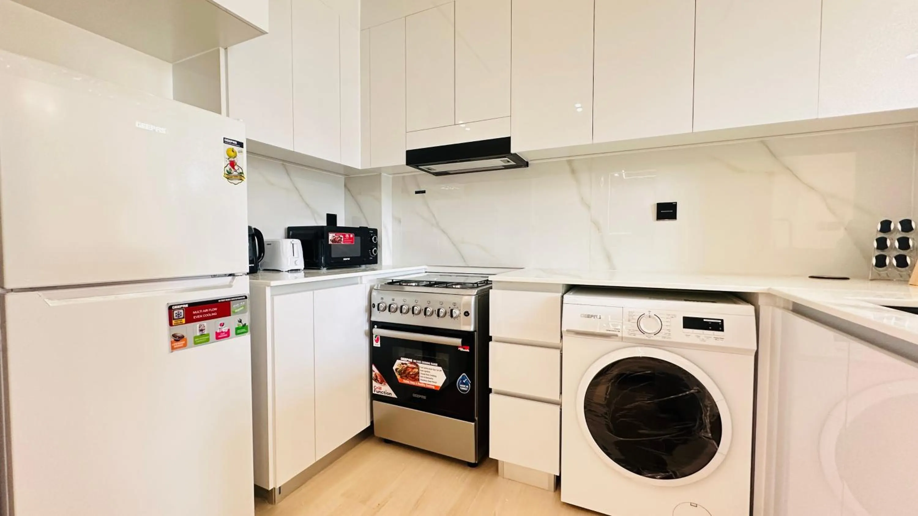 Kitchen or kitchenette in OYO 1291 Home Fully Furnished 1bed Apt @JVC