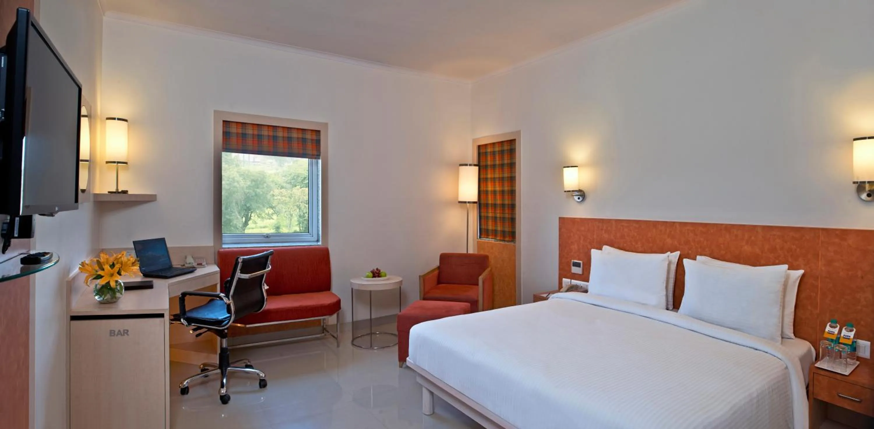 Bed in Nirwana Hometel Jaipur- A Sarovar Hotel