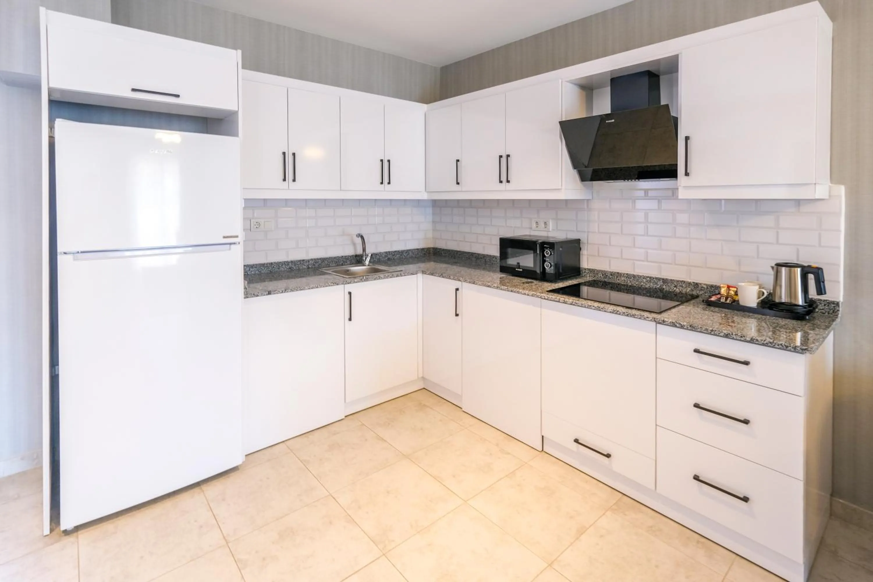Kitchen or kitchenette in Days Inn by Wyndham Alanya