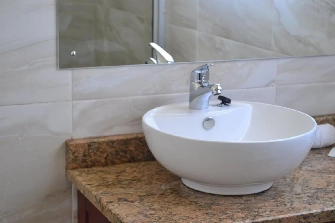 Toilet in Pemabwe Guest Lodge