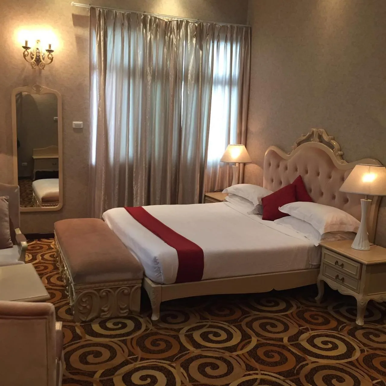 Bed in Ambassador Hotel