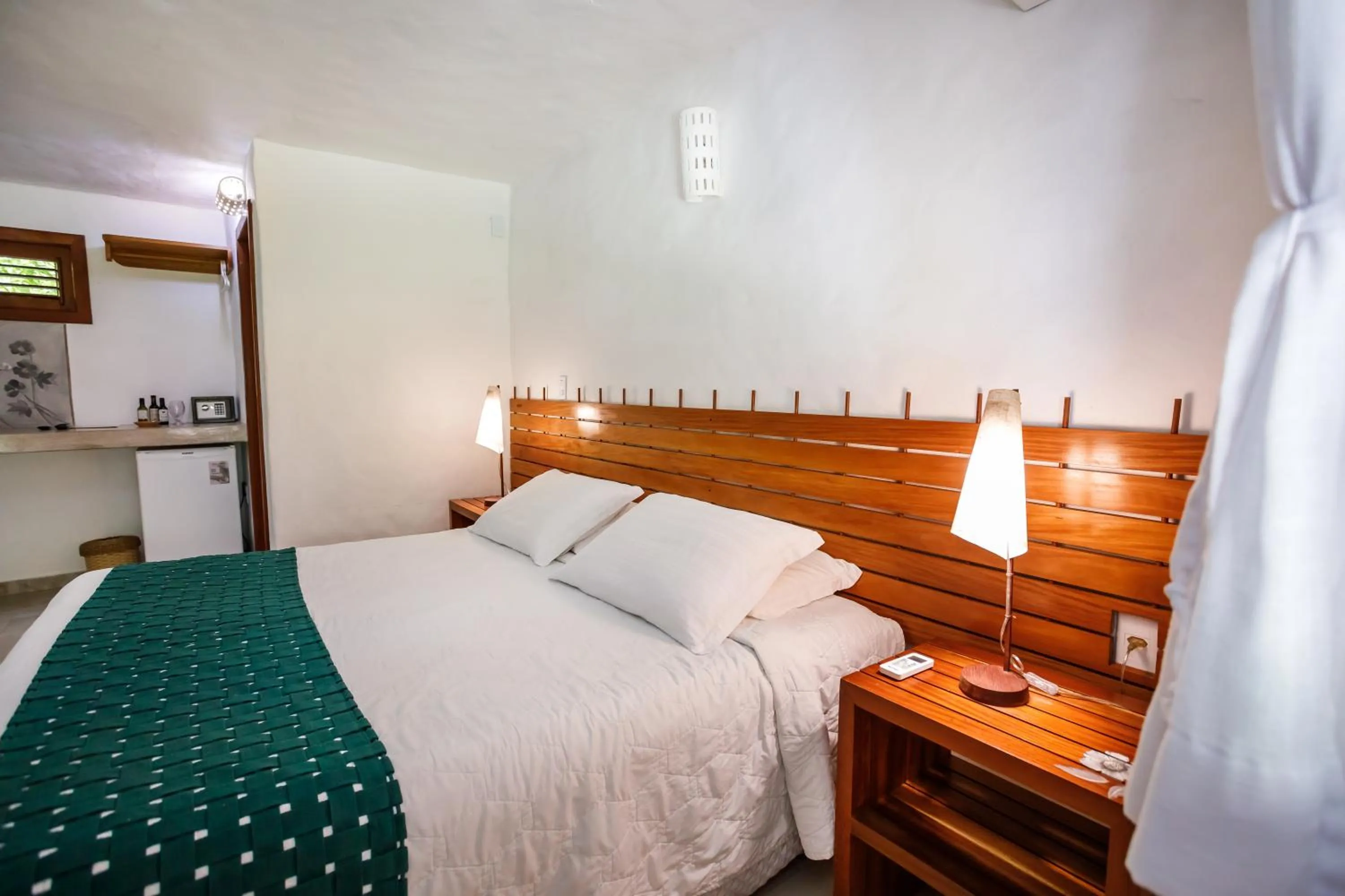 Bed in Pousada Rigatoni