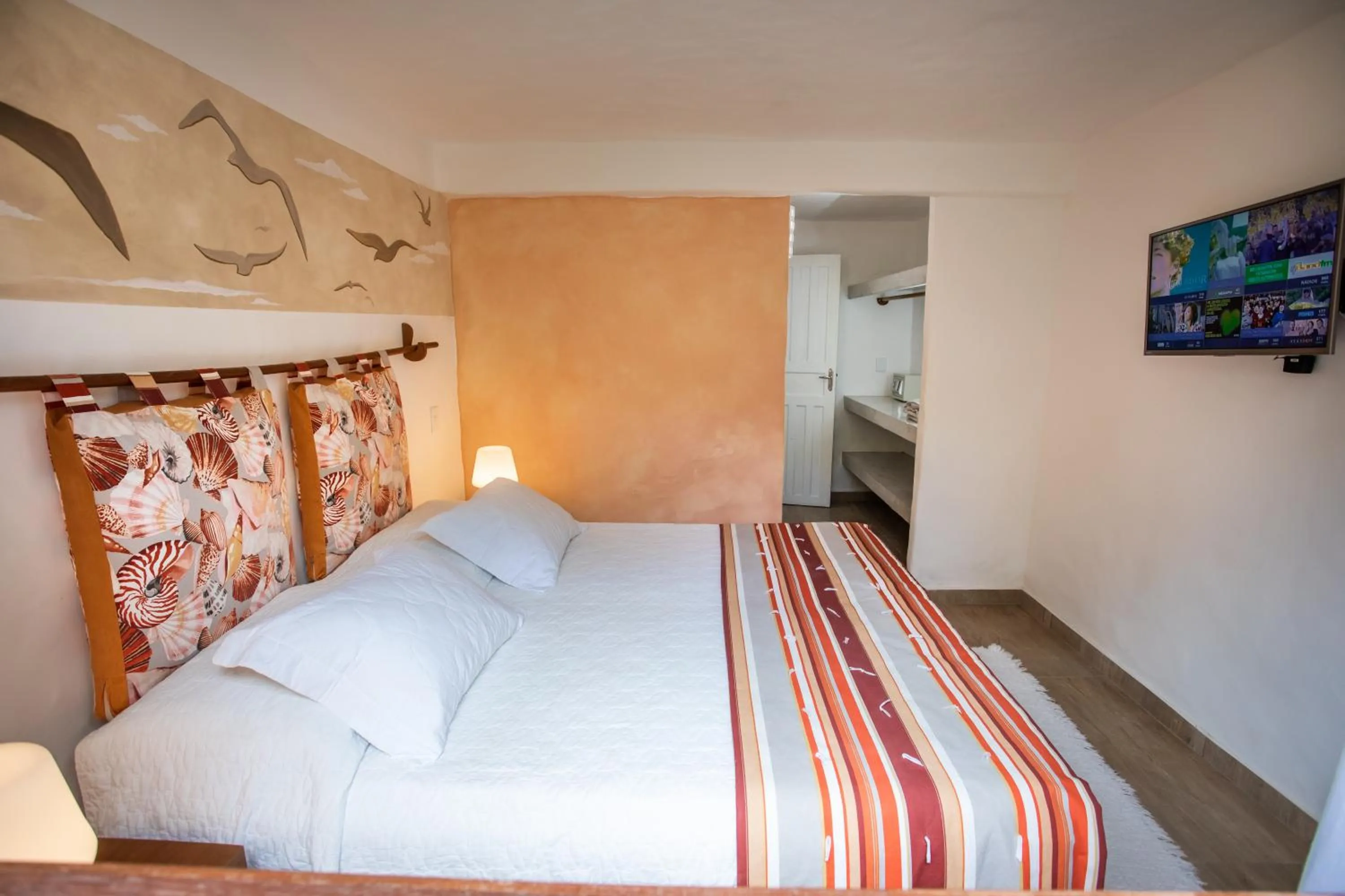 Bed in Pousada Rigatoni