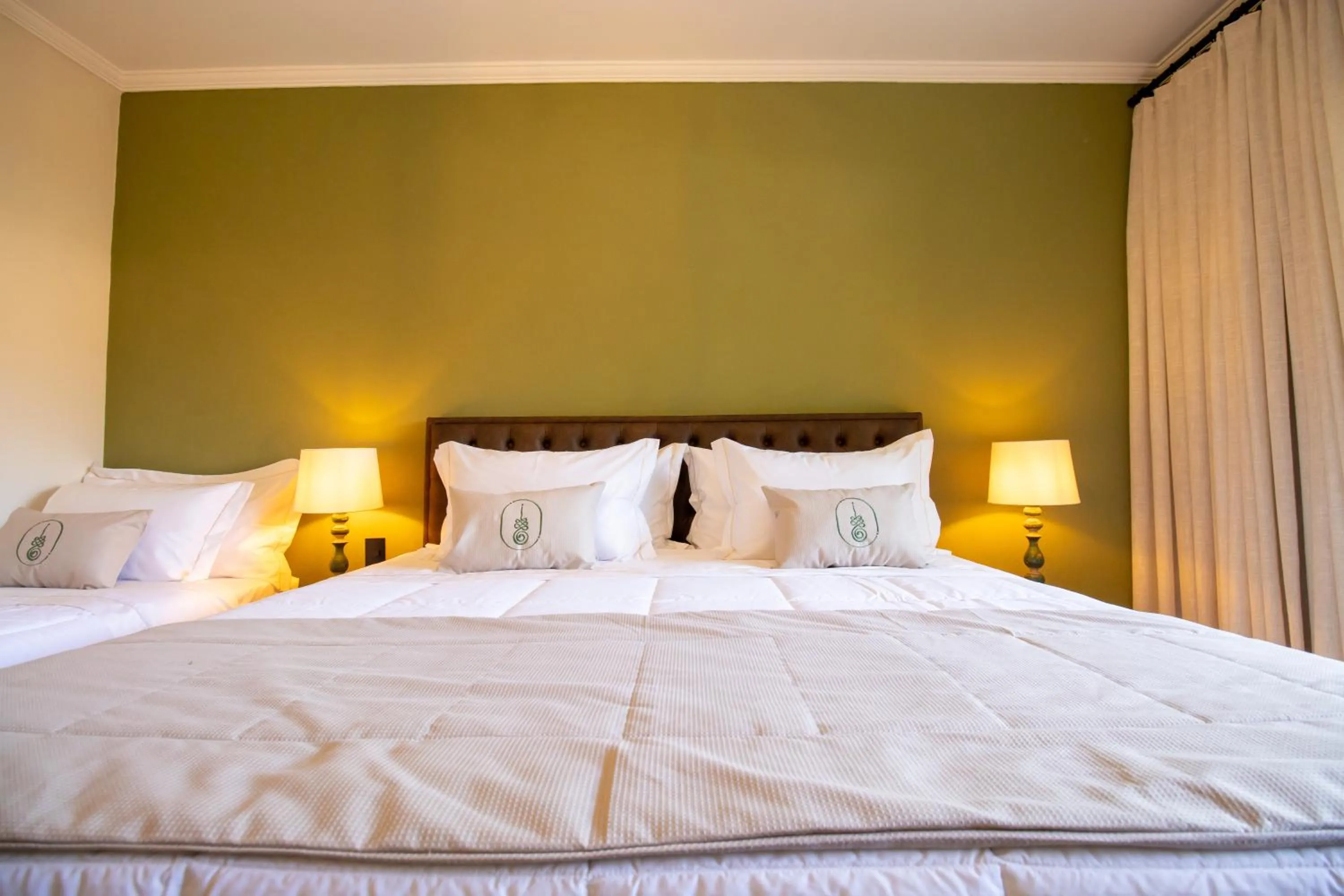 Bed in Unalome Pousada