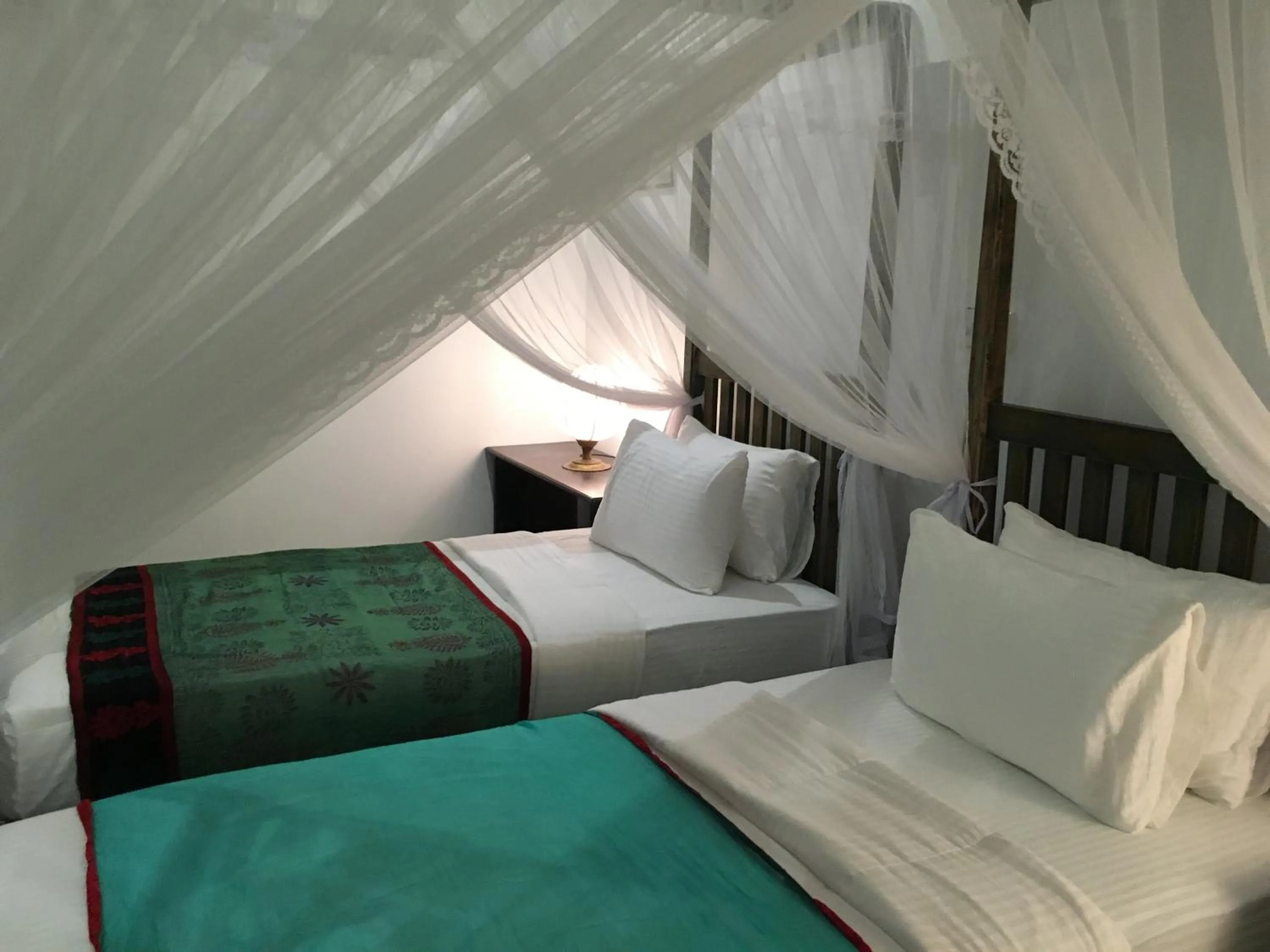 Bed in Khalid's Guest House