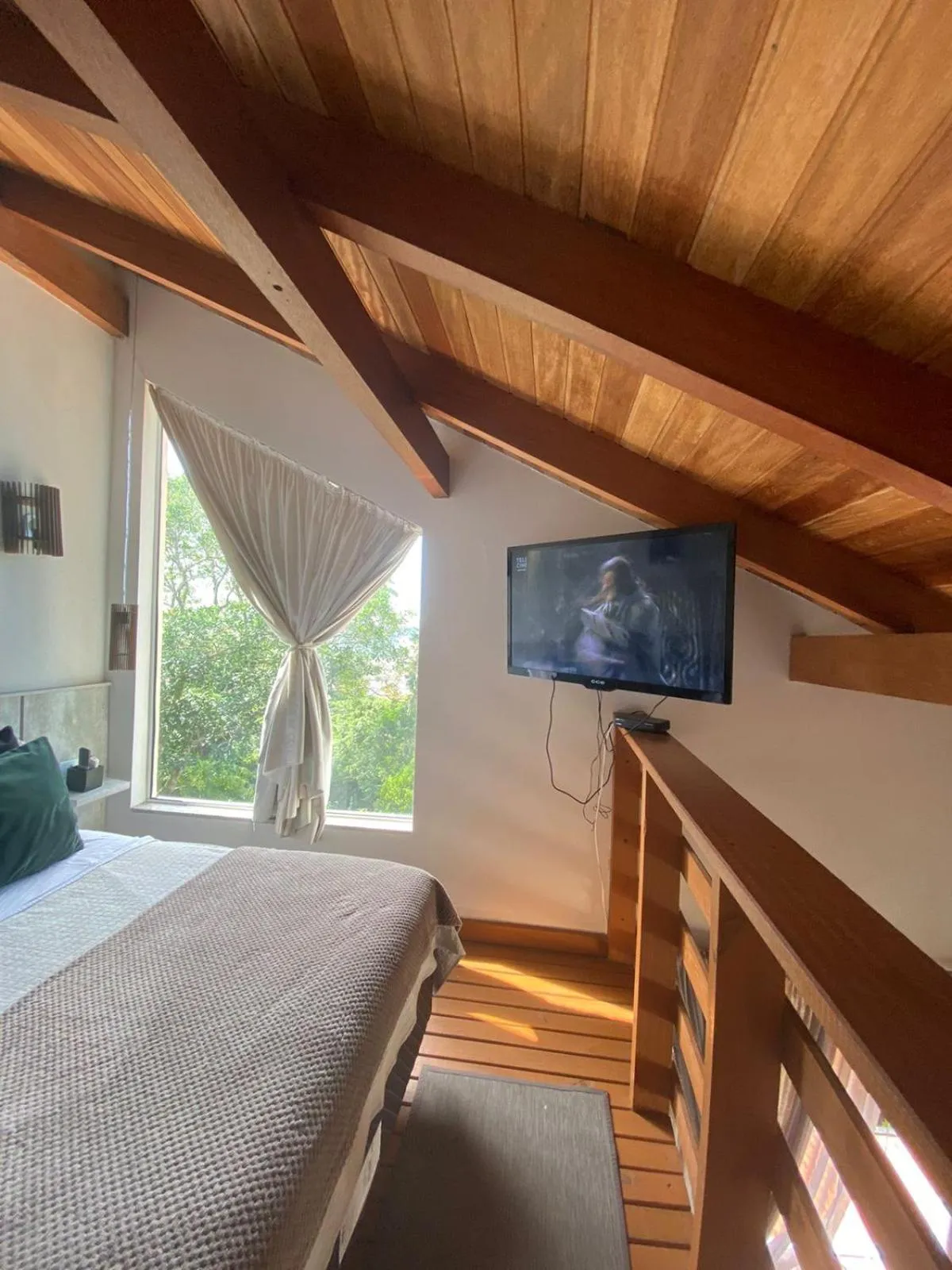 Bed in Bombinhas Guest House