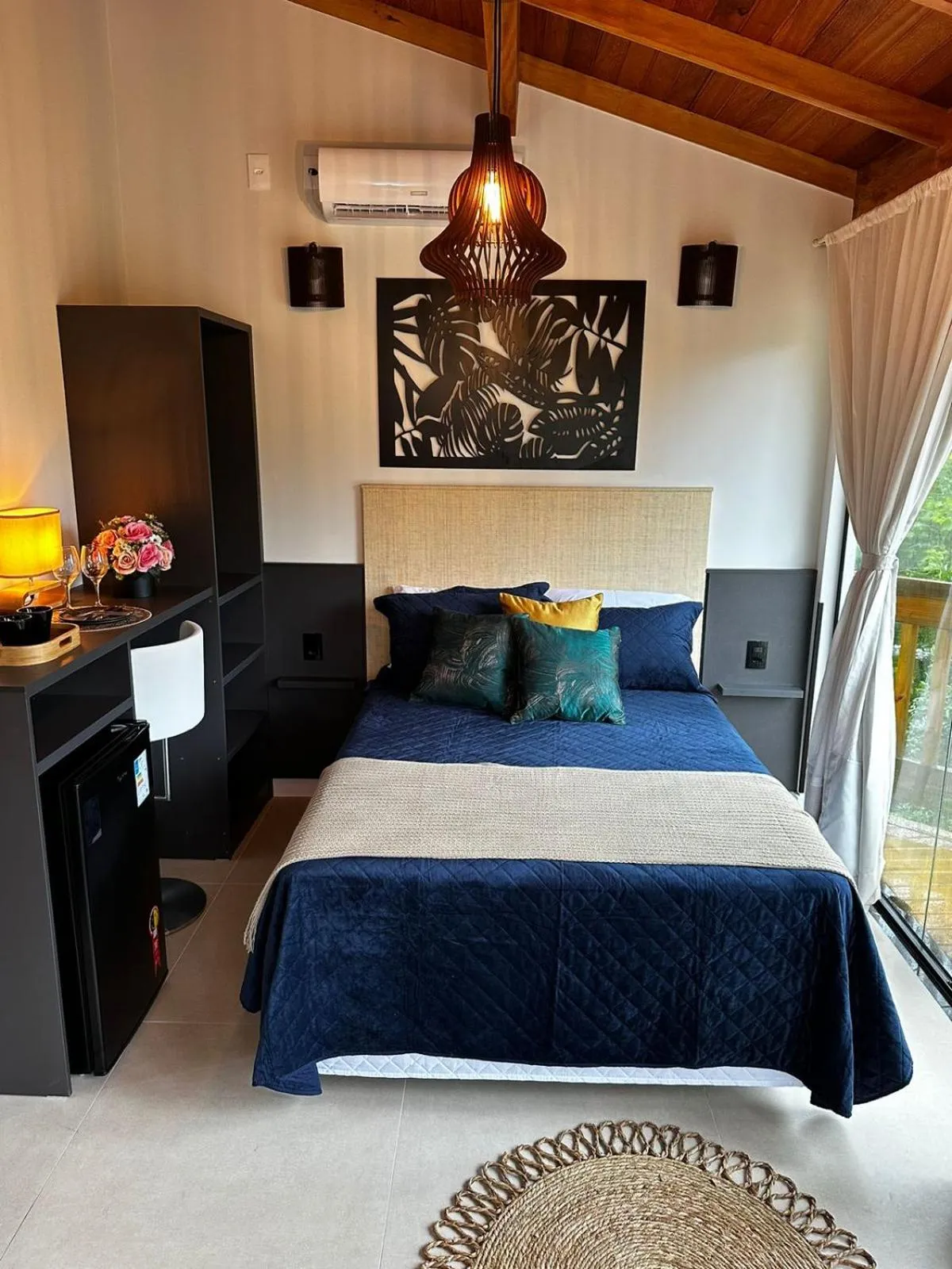 Bed in Bombinhas Guest House