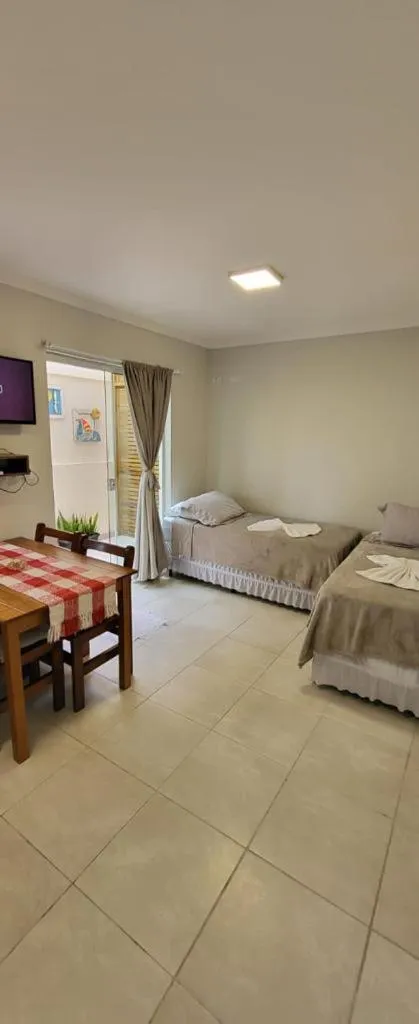 Bed in Bombinhas Guest House