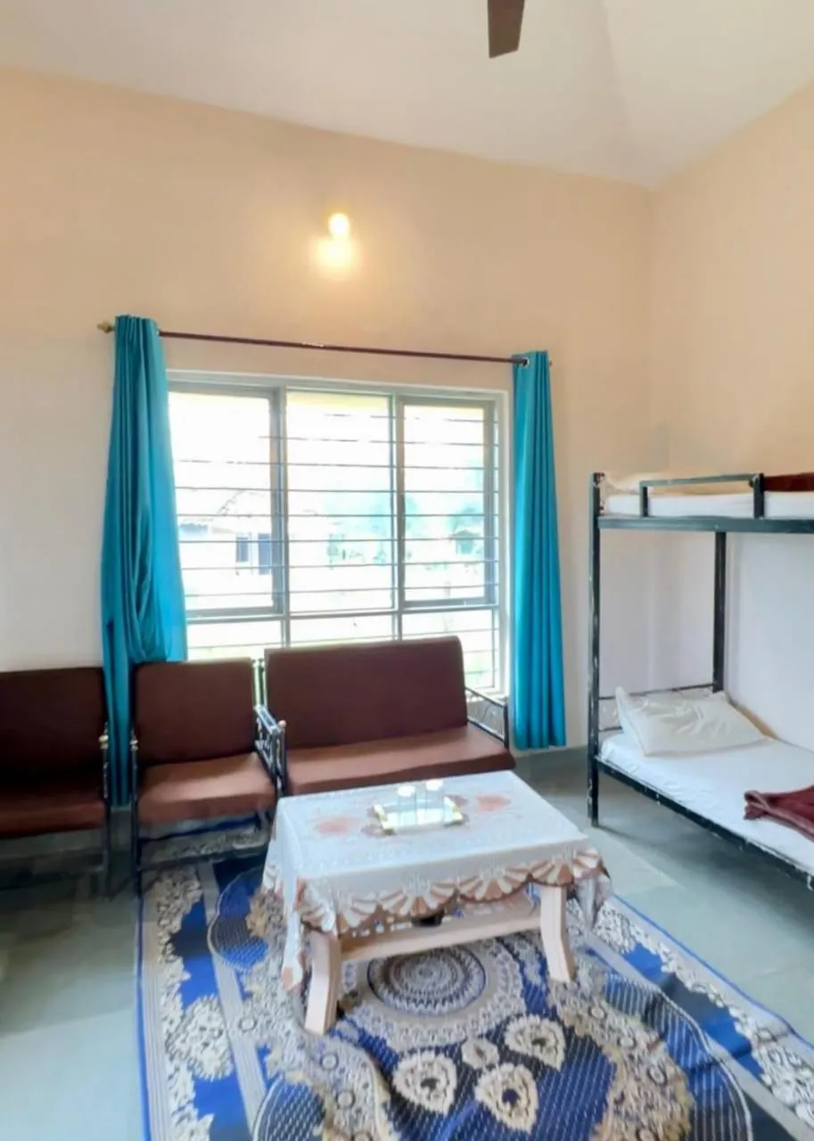 Seating area, Bed in Tribal Wood Resort