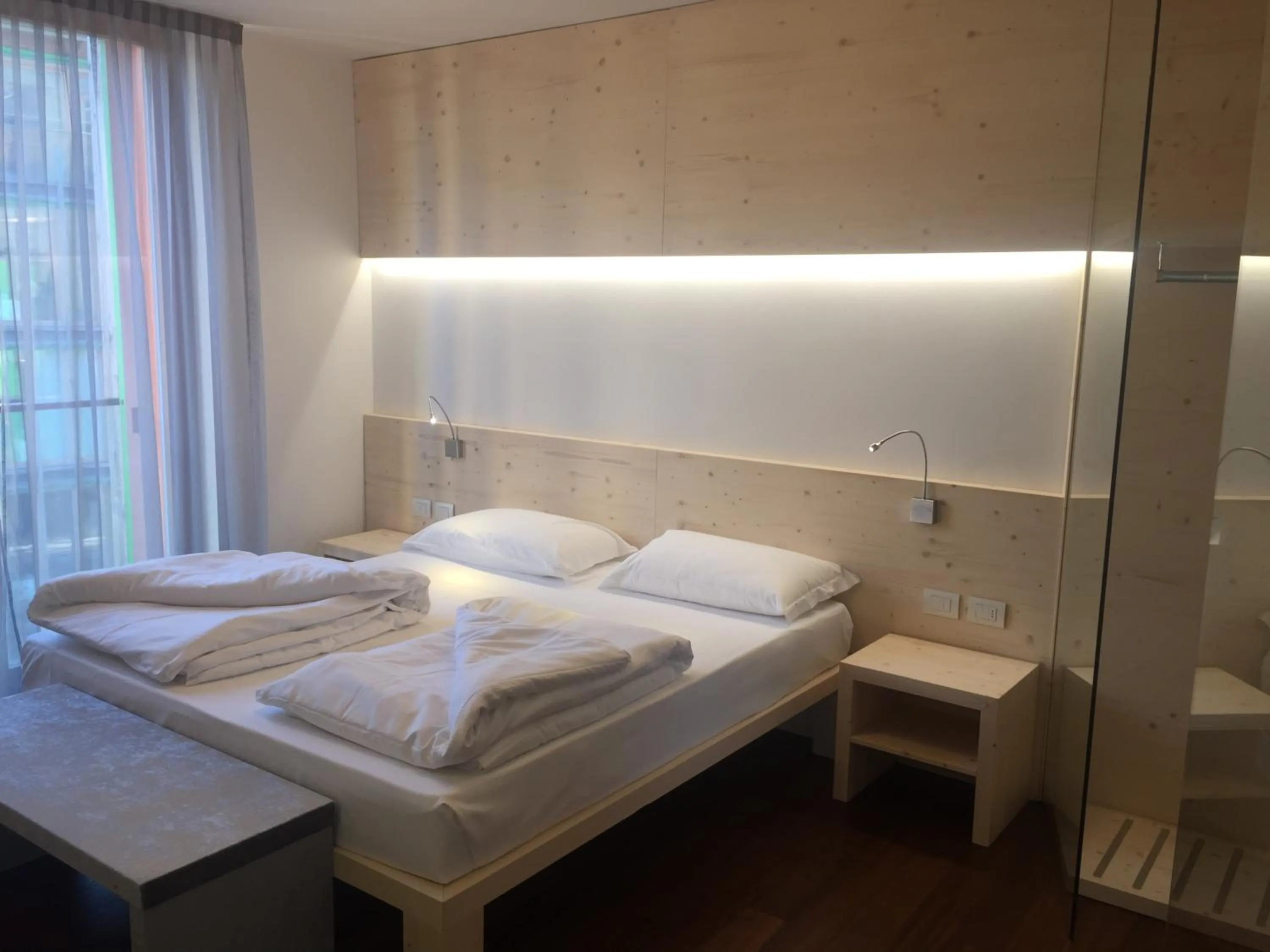 Bed in Komodo short stay apartments