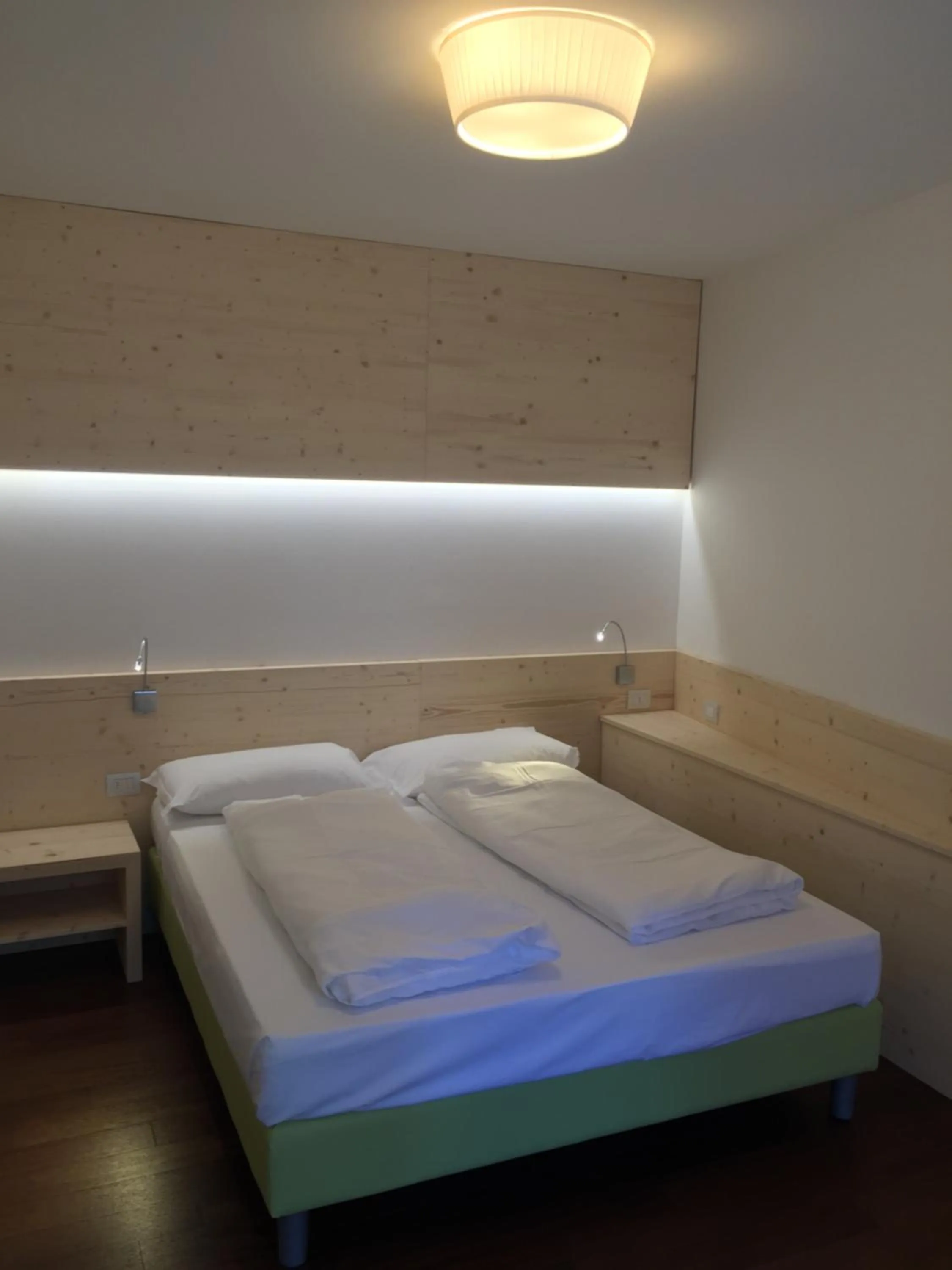 Bed in Komodo short stay apartments