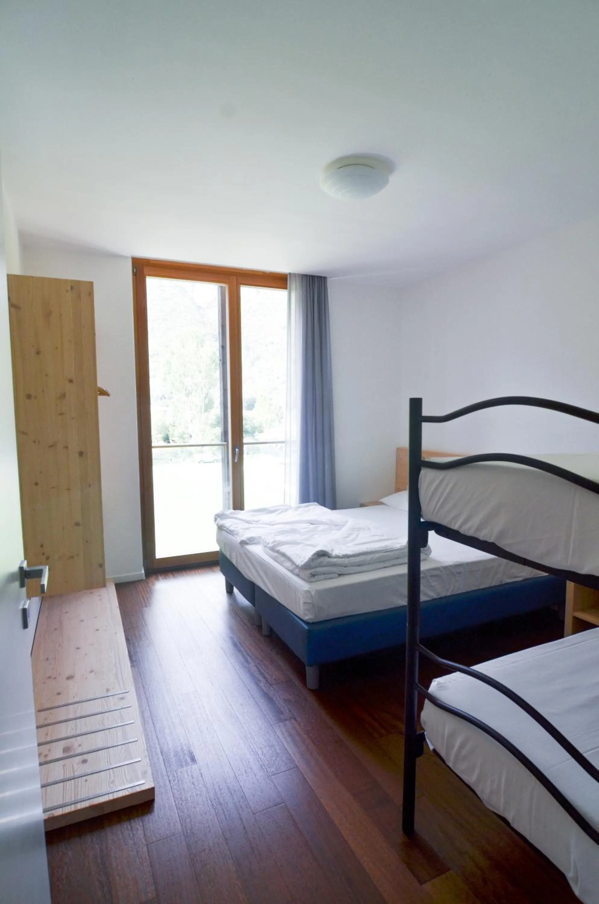 Bed in Komodo short stay apartments