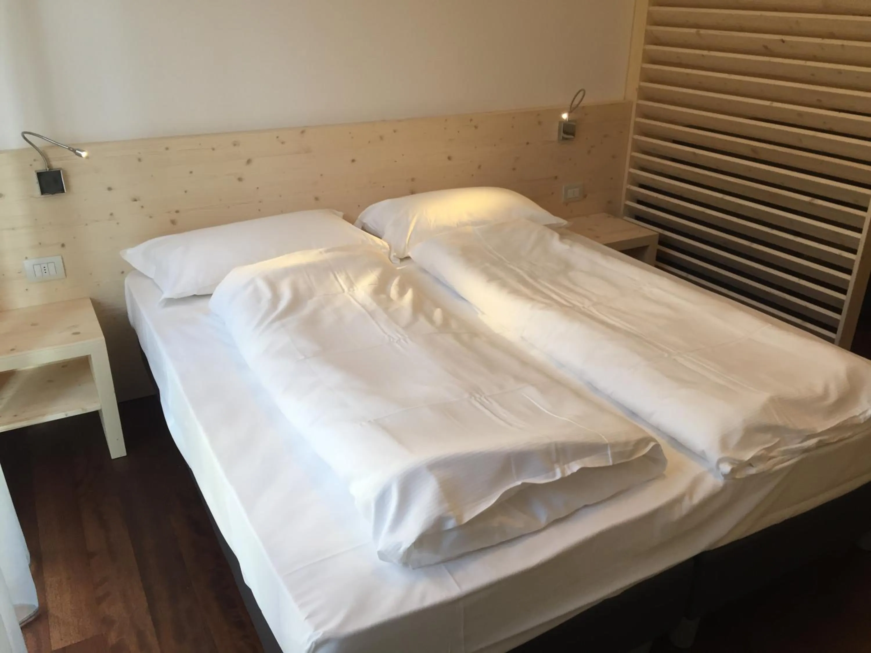 Bed in Komodo short stay apartments