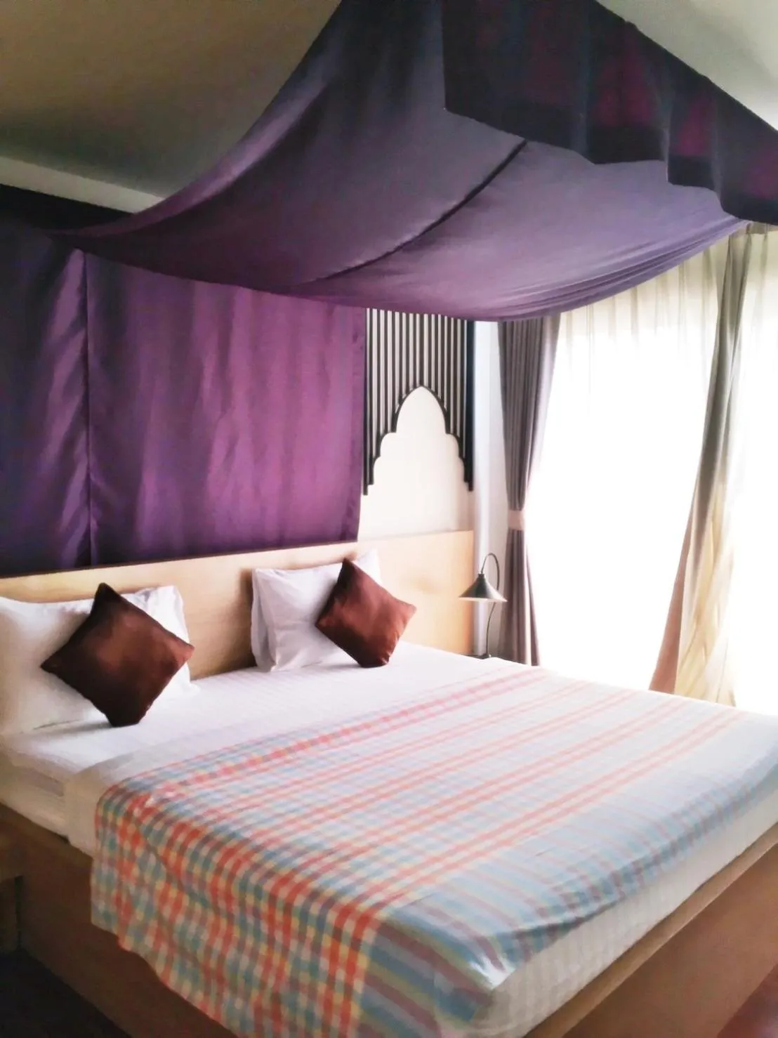 Bed in Nakorn De Sukhothai Hip Hotel