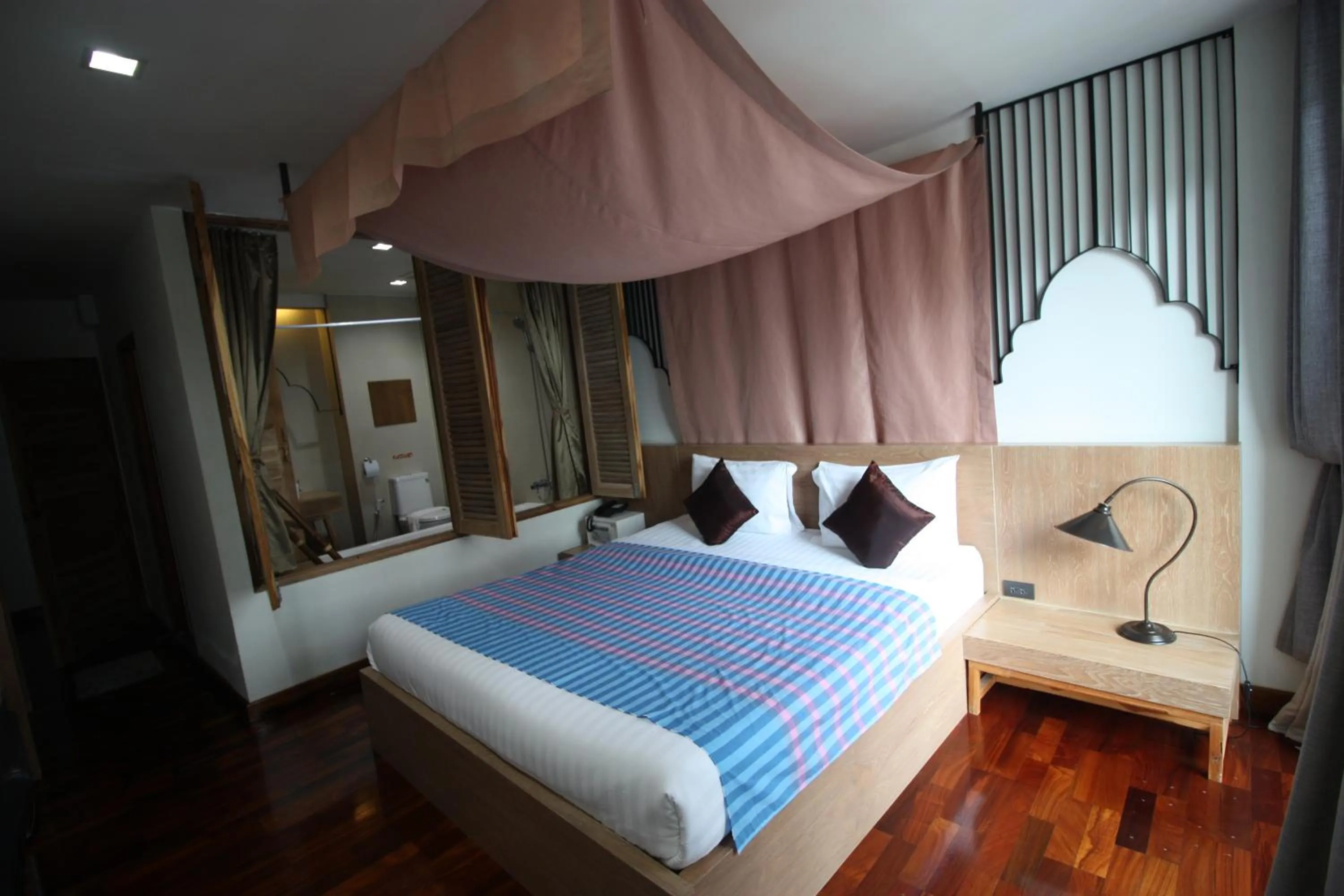 Bed in Nakorn De Sukhothai Hip Hotel