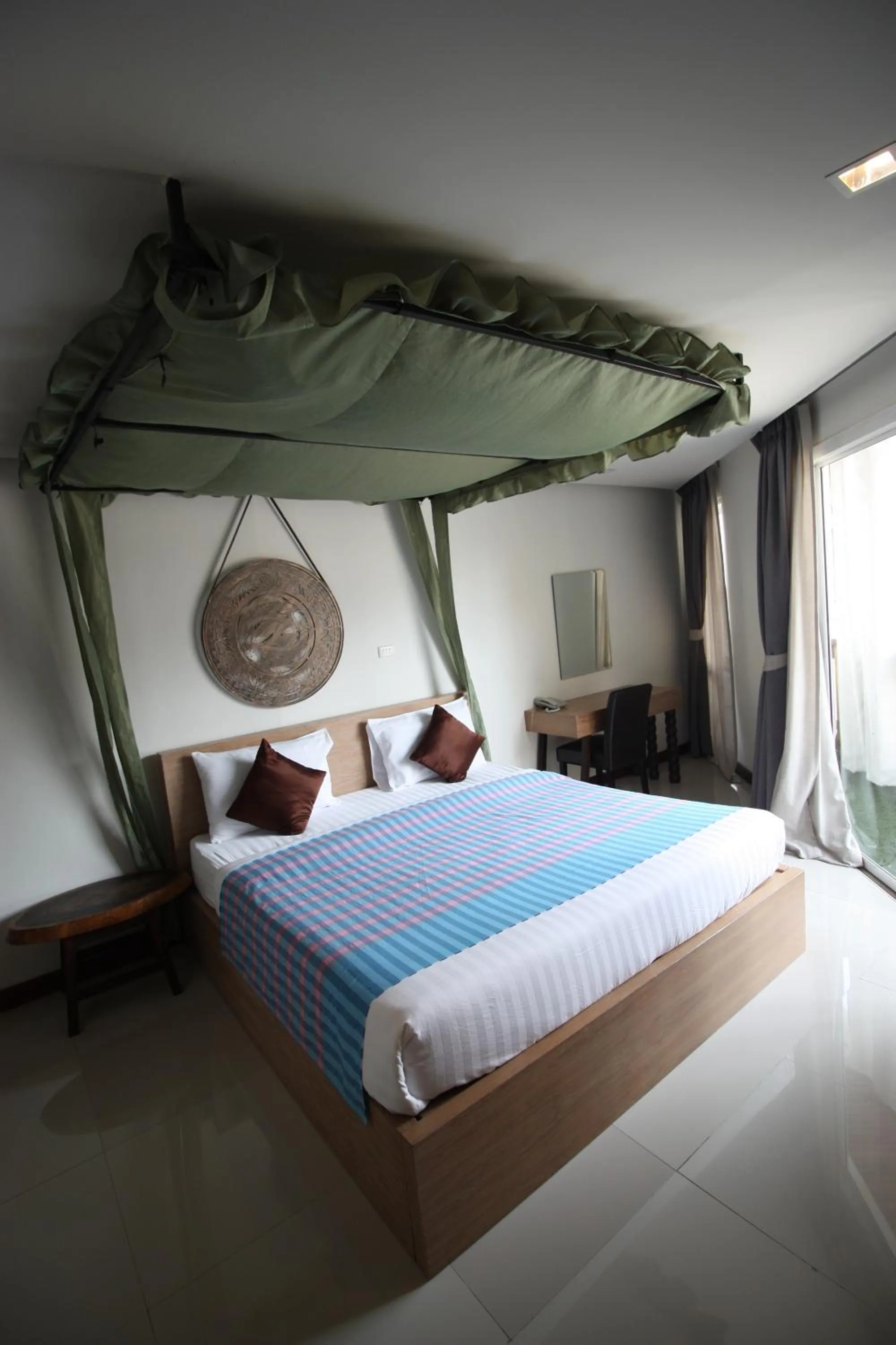 Bed in Nakorn De Sukhothai Hip Hotel