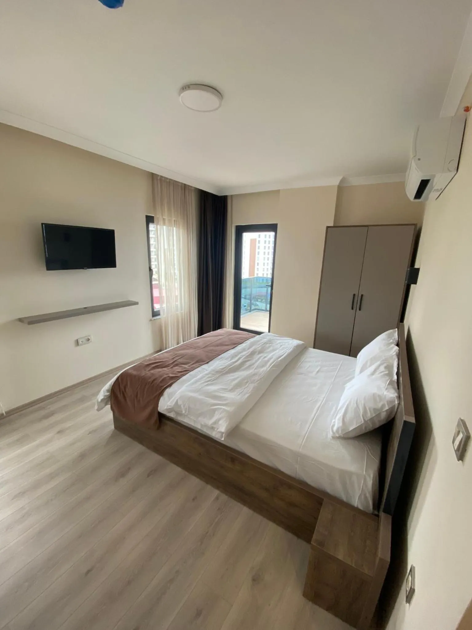 Bed in Rena Grand Residence & Suit