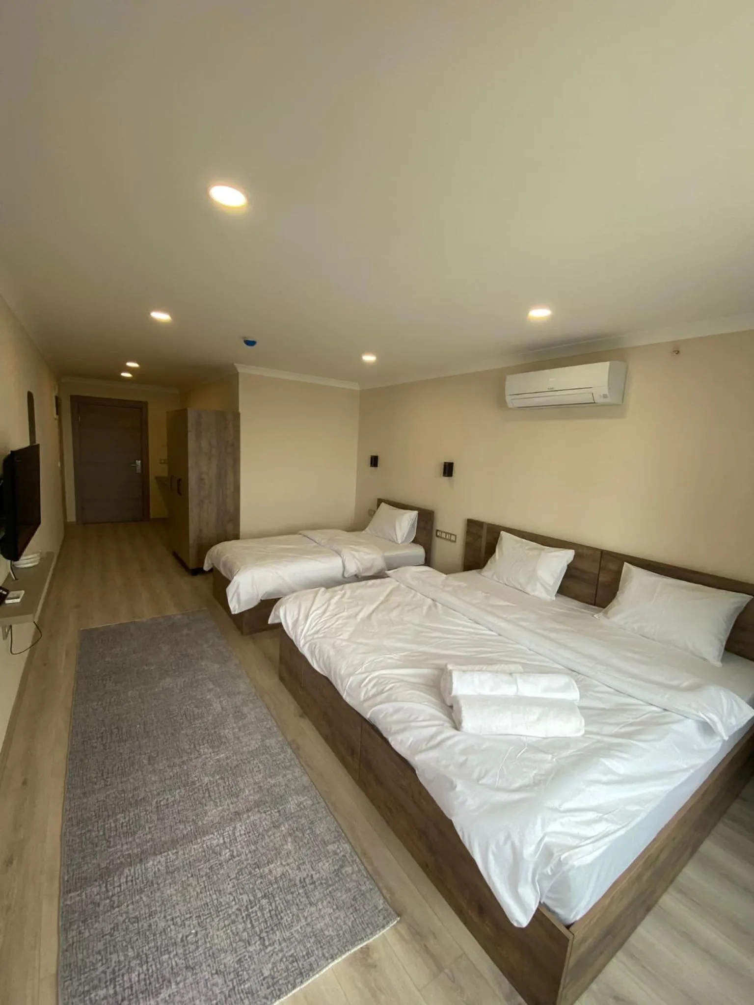 Bed in Rena Grand Residence & Suit