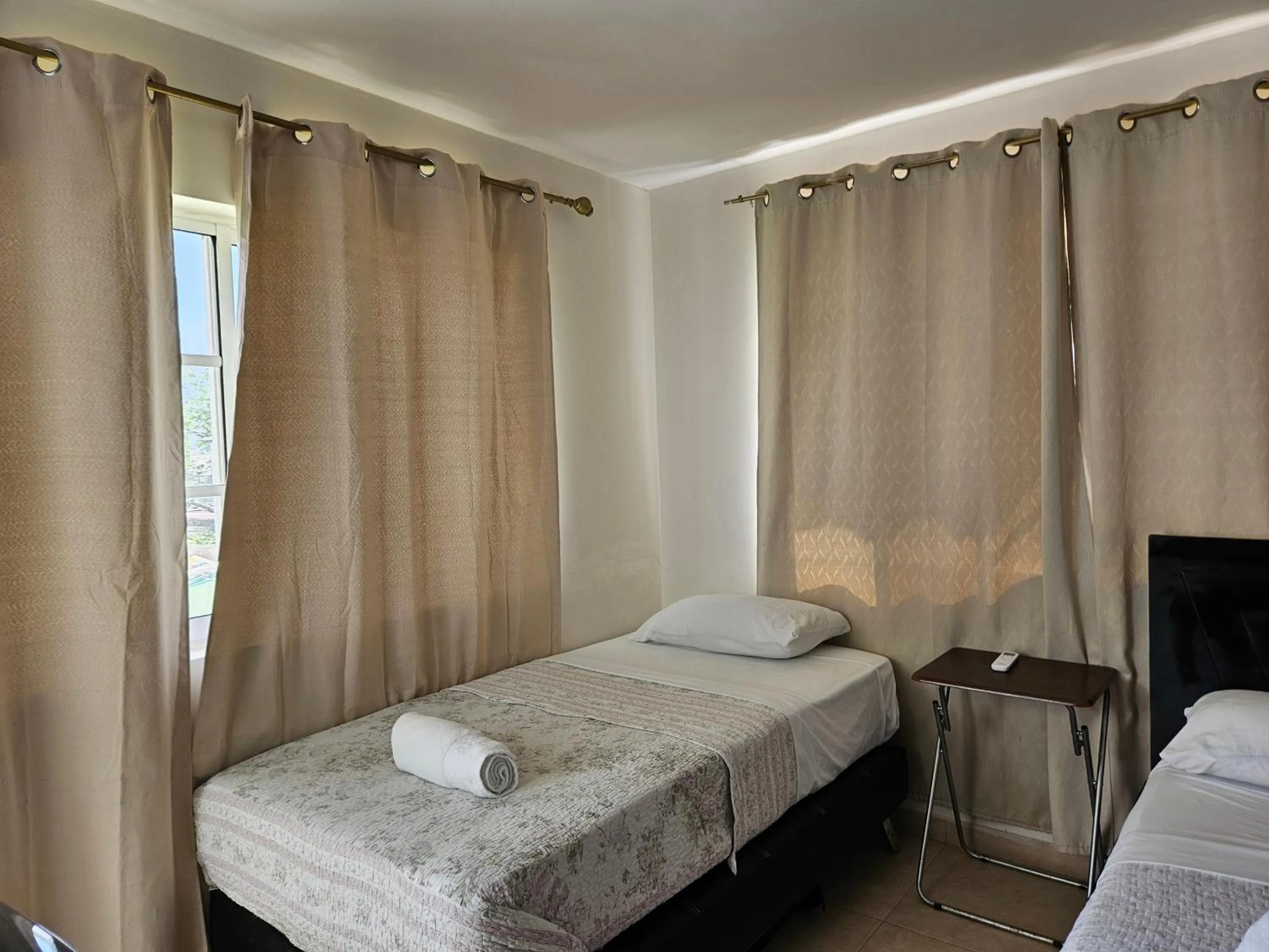 Bed in Caribbean Island Hotel Piso 2