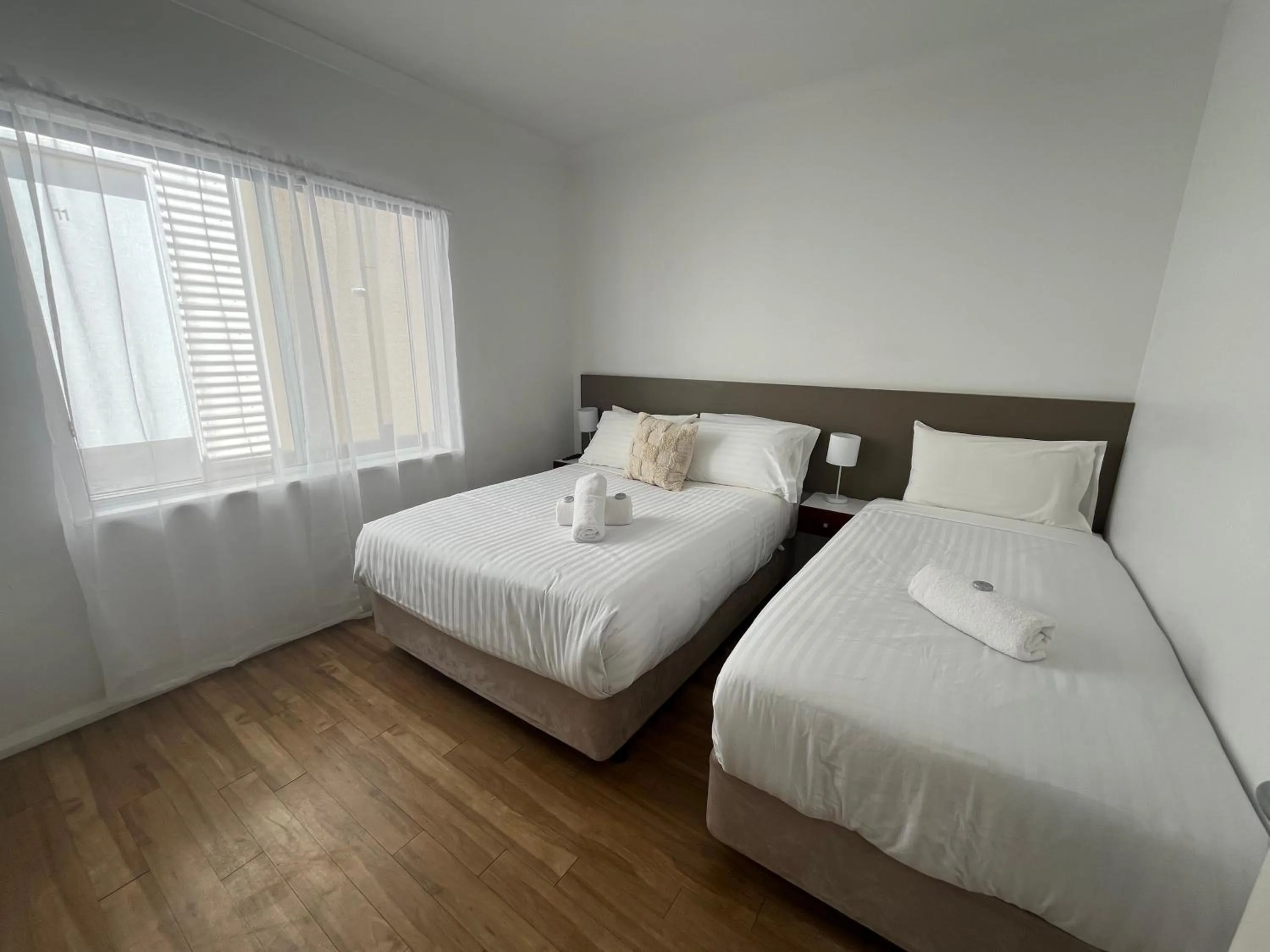 Bed in Clearwater Motel Apartments