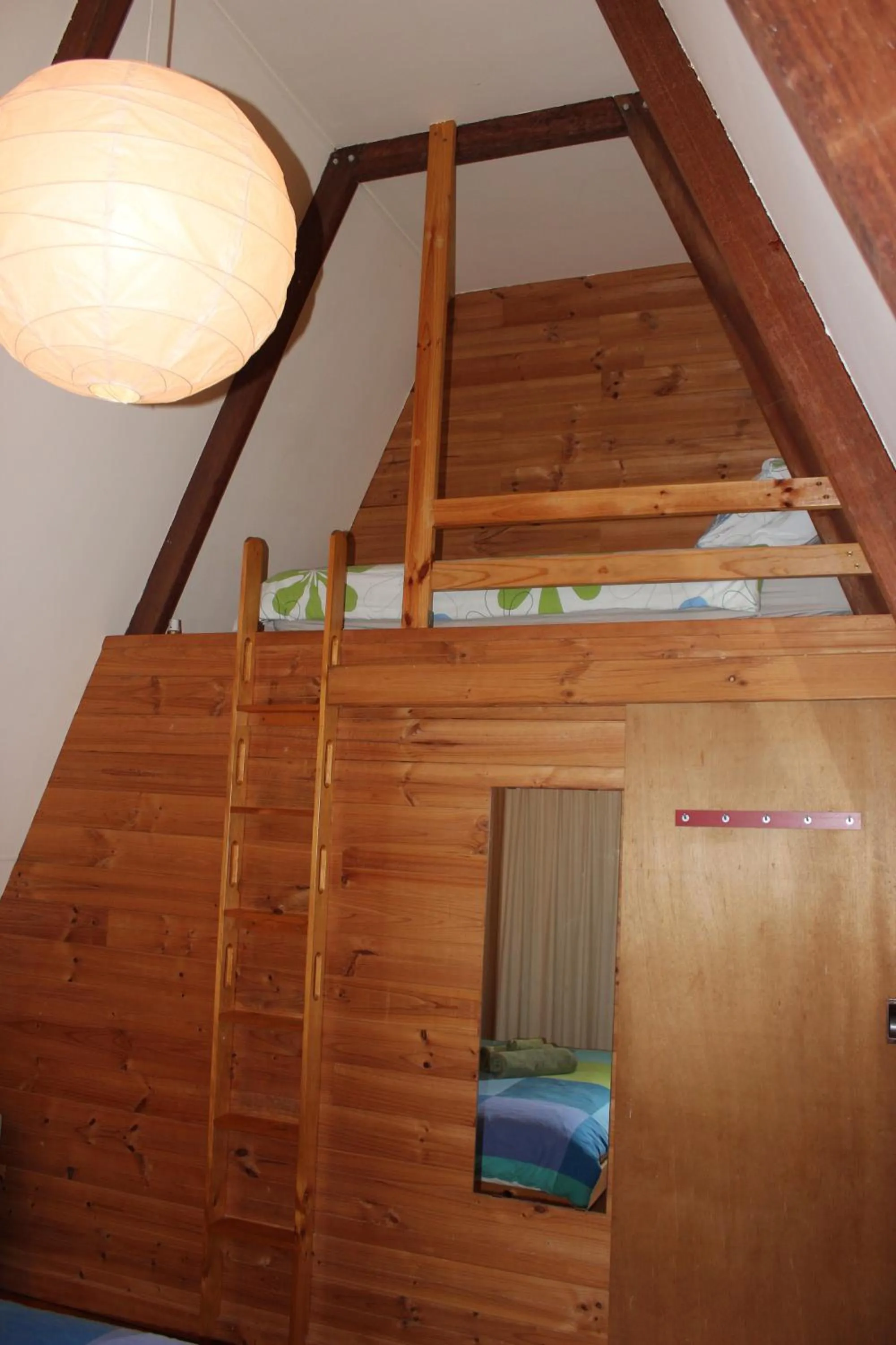 Bed in Green Leaves Cabin