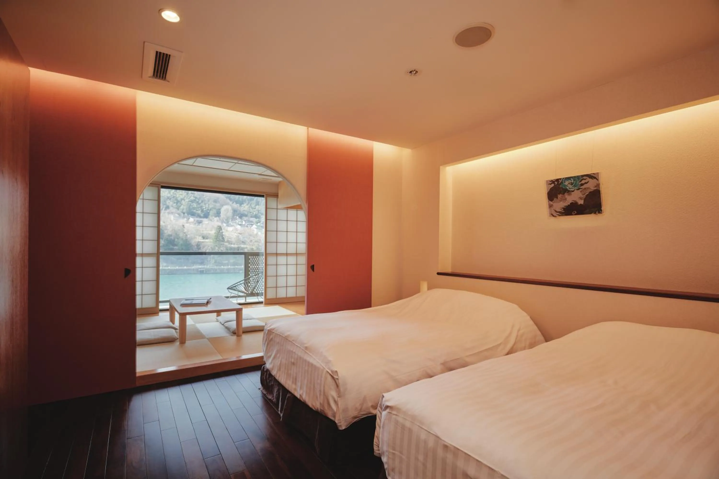 Photo of the whole room, Bed in River Retreat Garaku