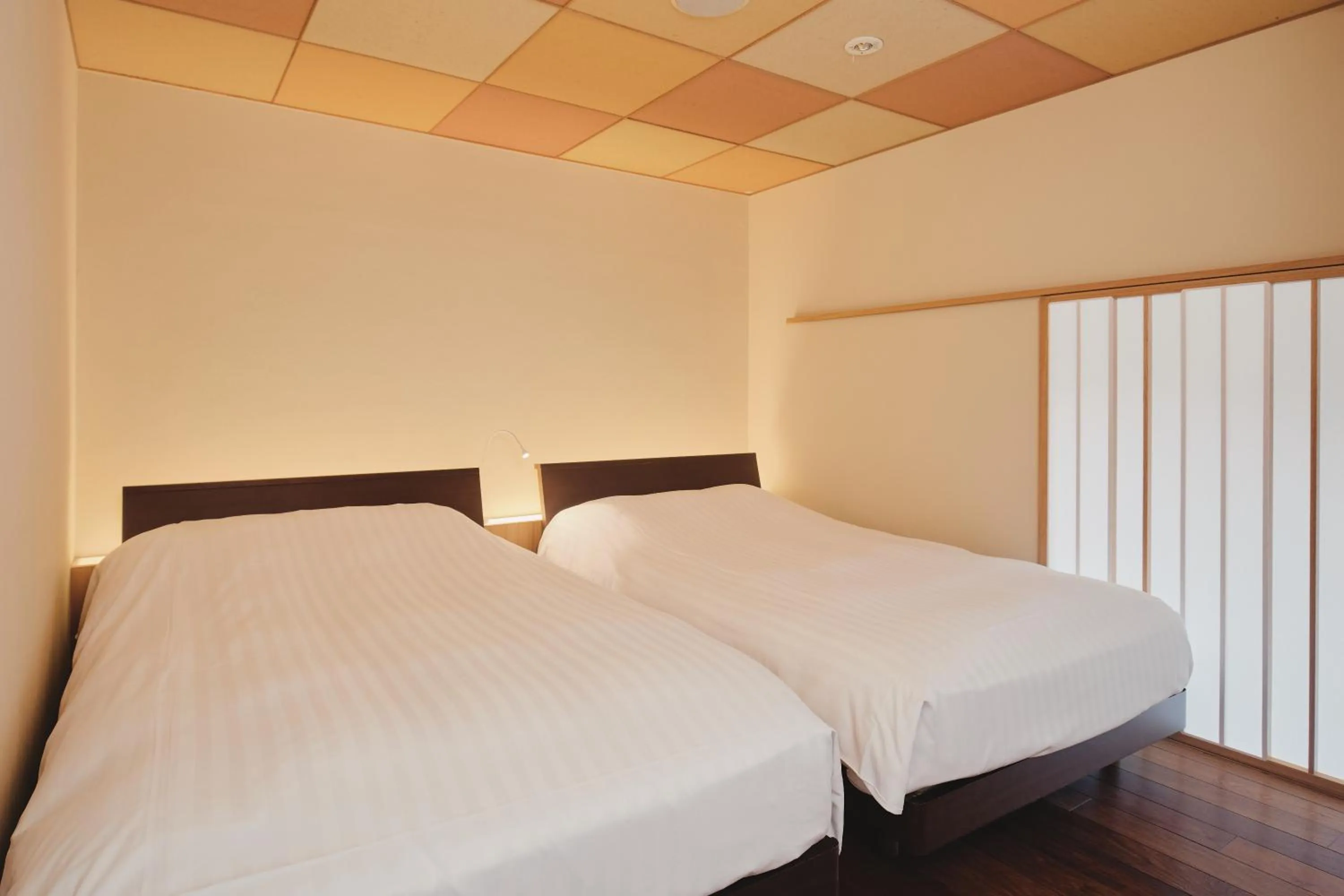 Photo of the whole room, Bed in River Retreat Garaku