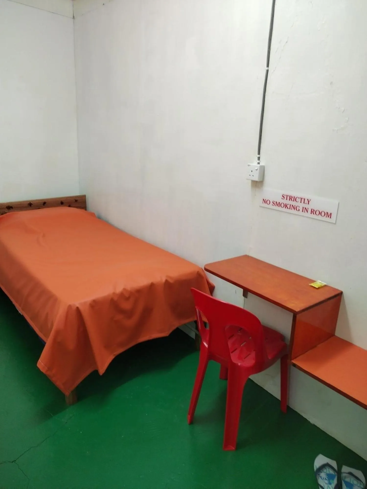 Photo of the whole room, Bed in WISMA ORCHID HOMESTAY Tuaran