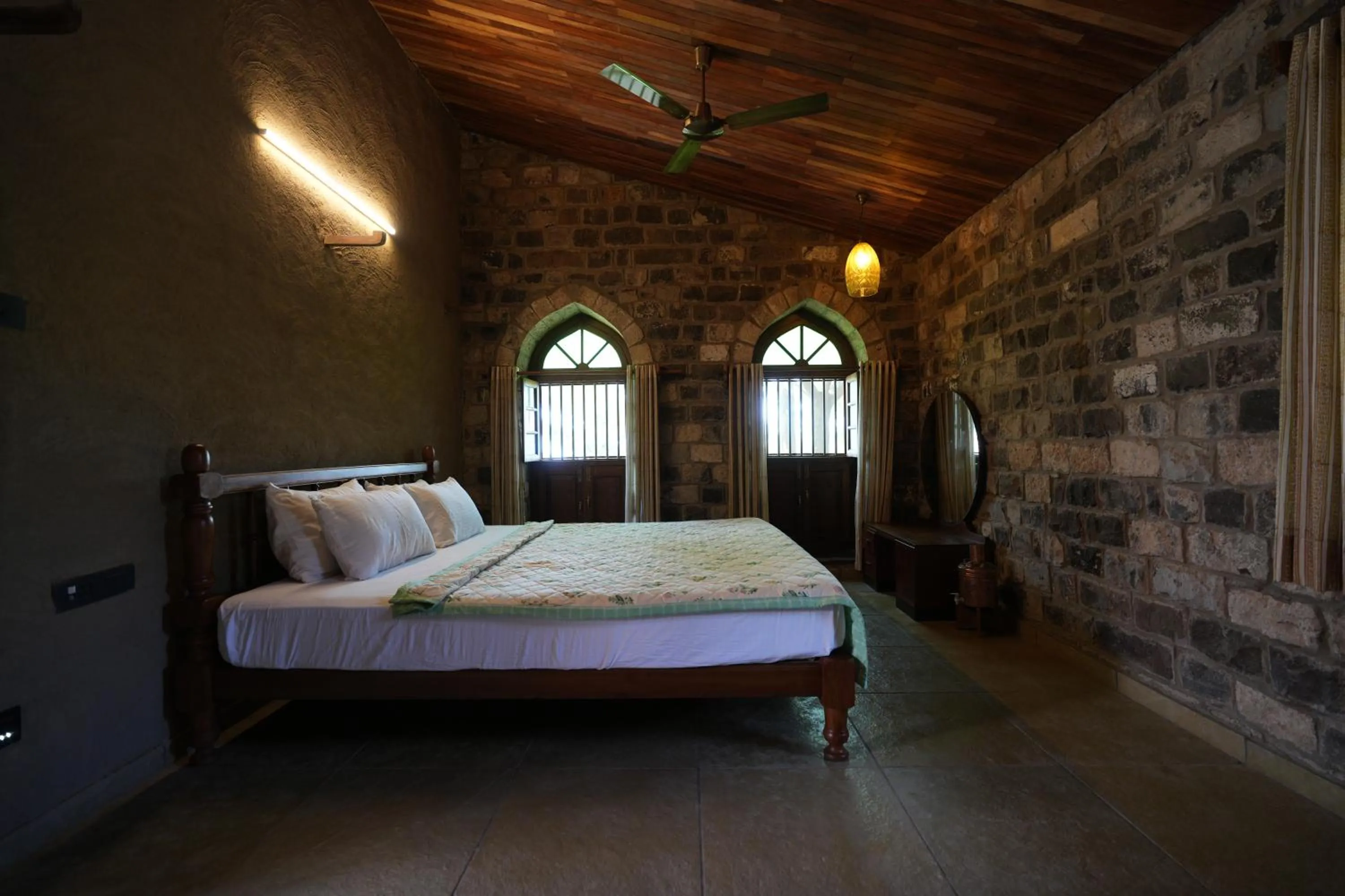 Bed in Nisarg Resort