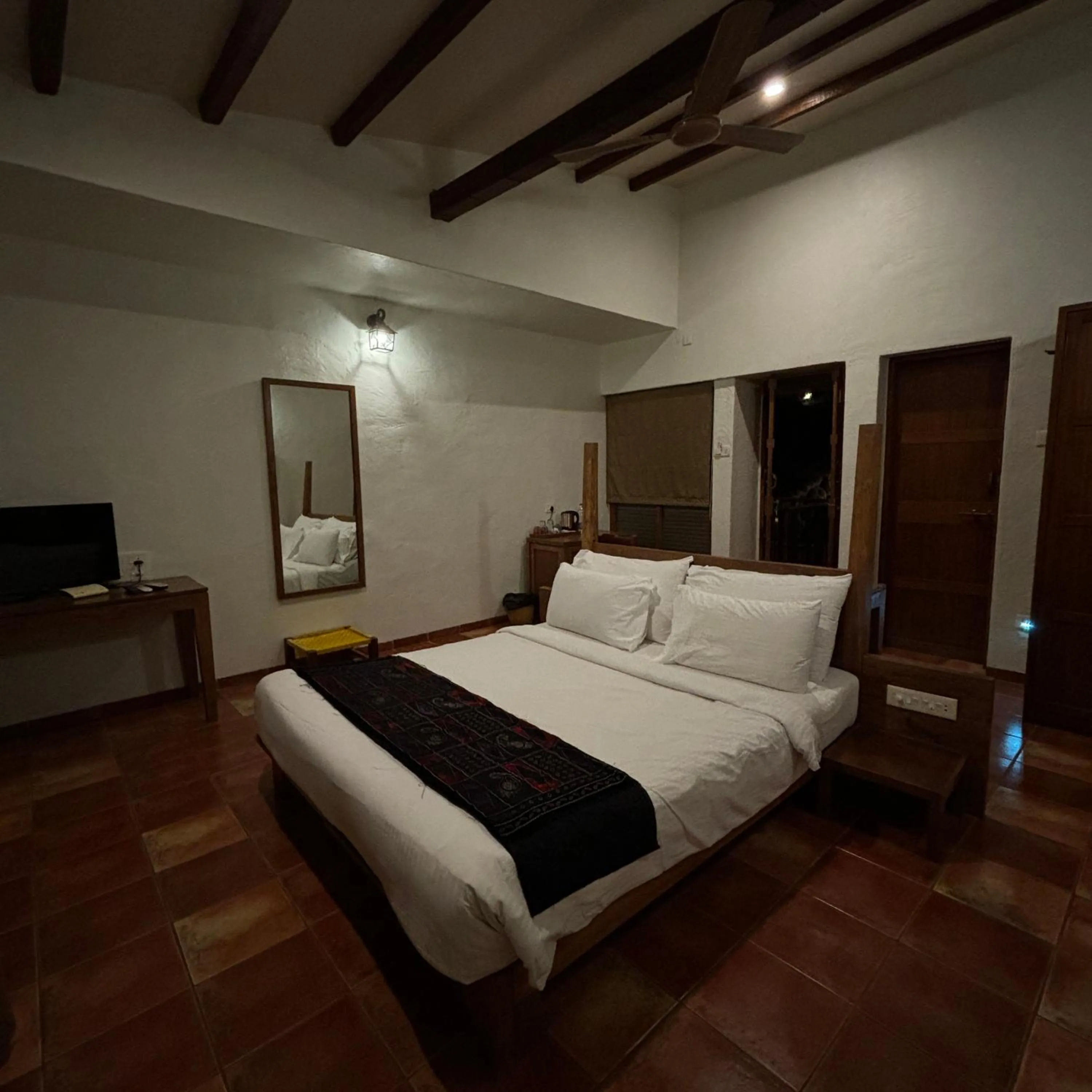 Bed in Nisarg Resort