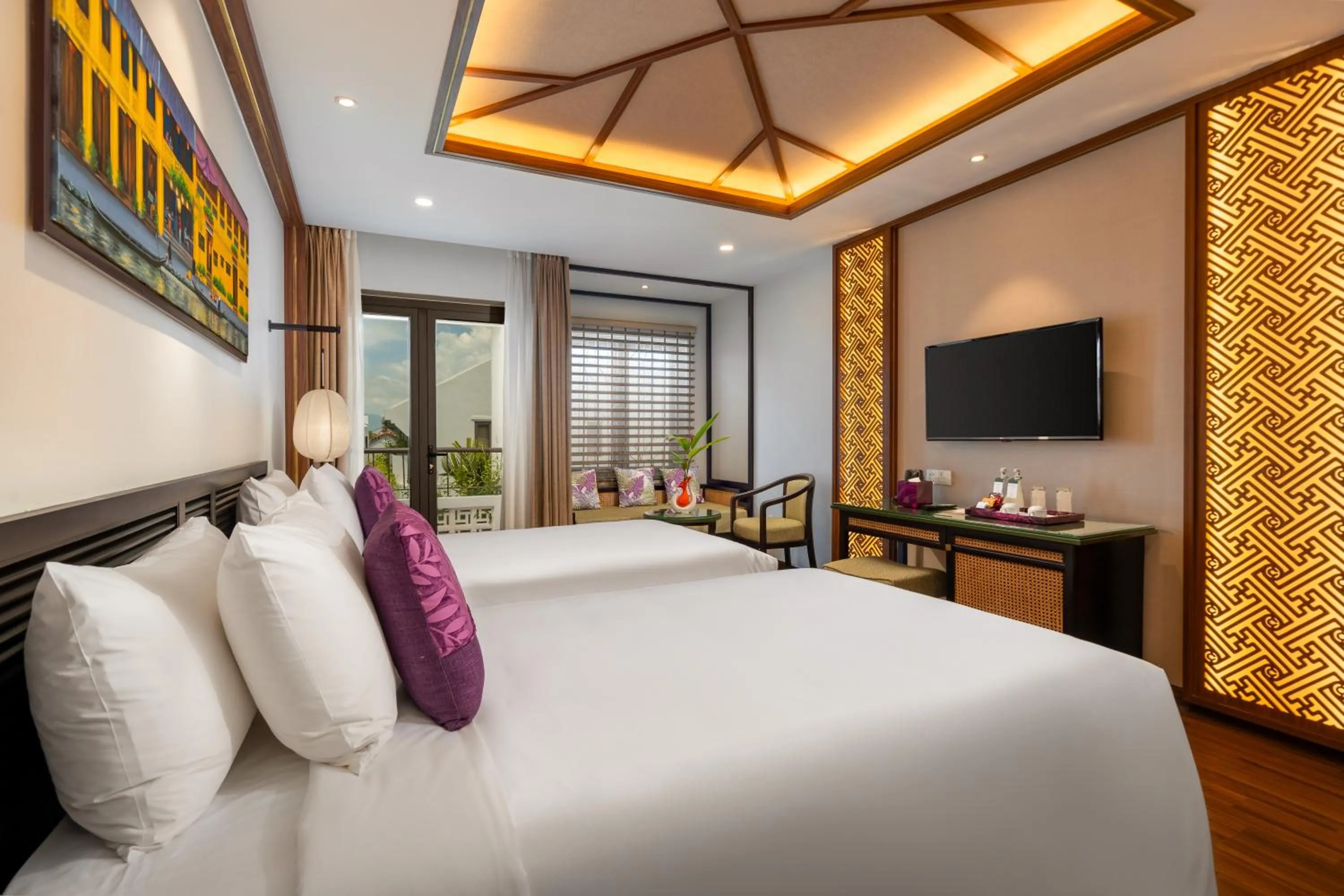 Communal lounge/ TV room, Bed in The Saga Hotel Hoi An