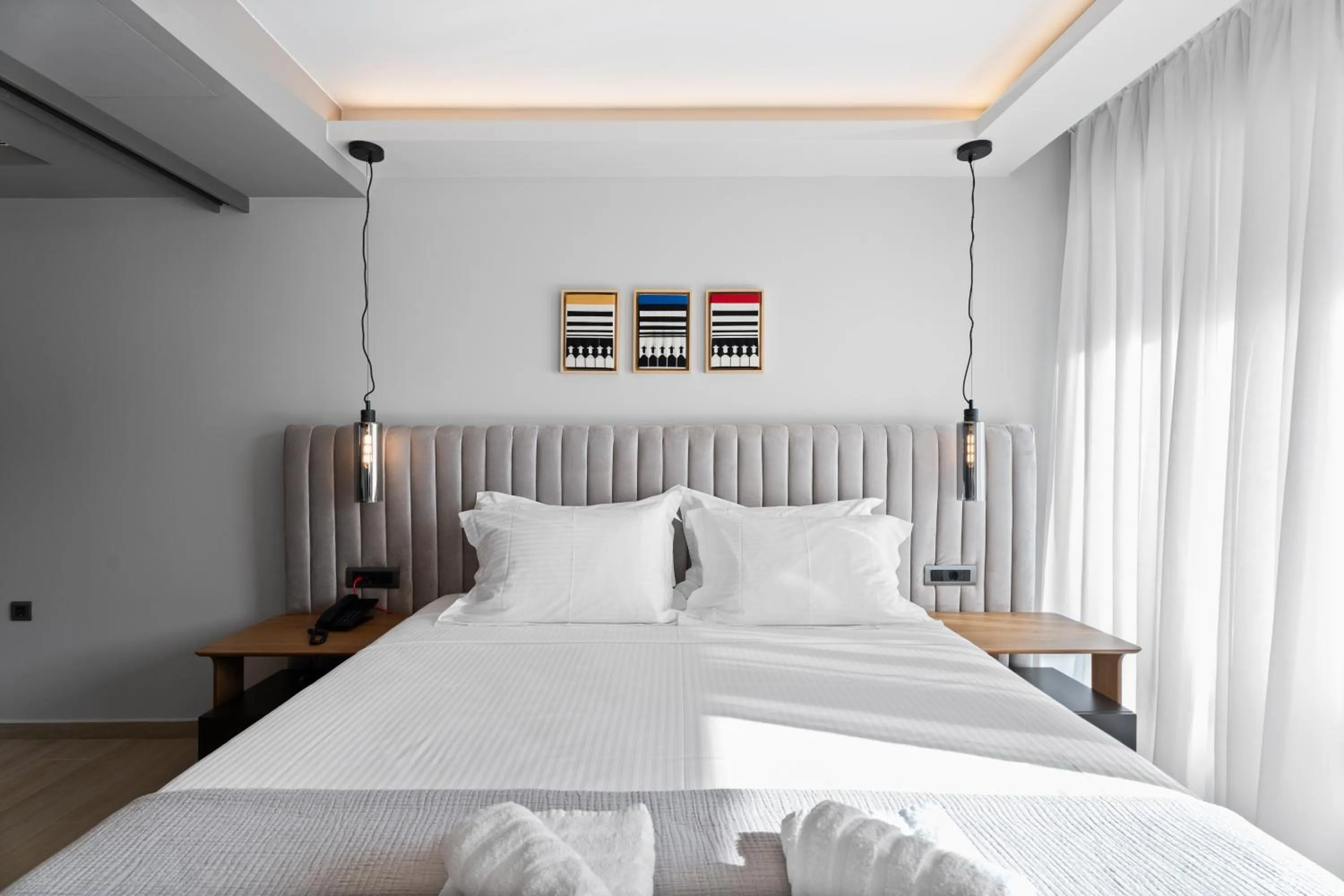 Bed in Ennea Muses Rooms and Suites