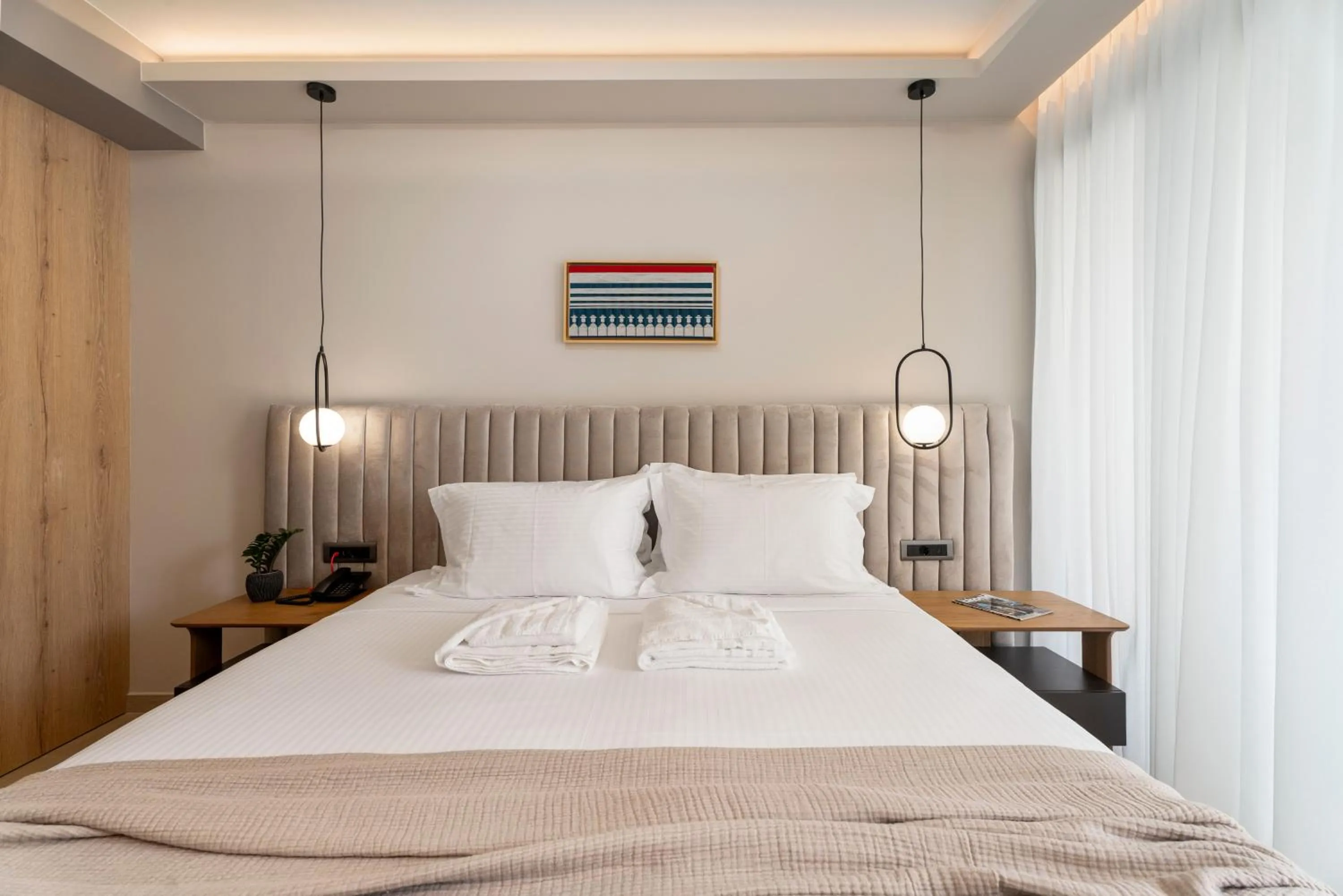 Bed in Ennea Muses Rooms and Suites