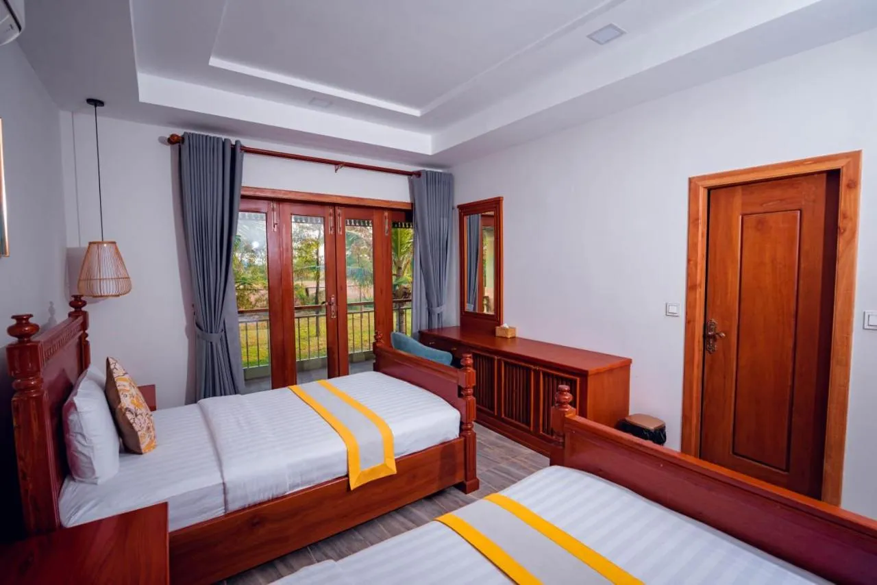 Bed in Ganesha Kampot Resort