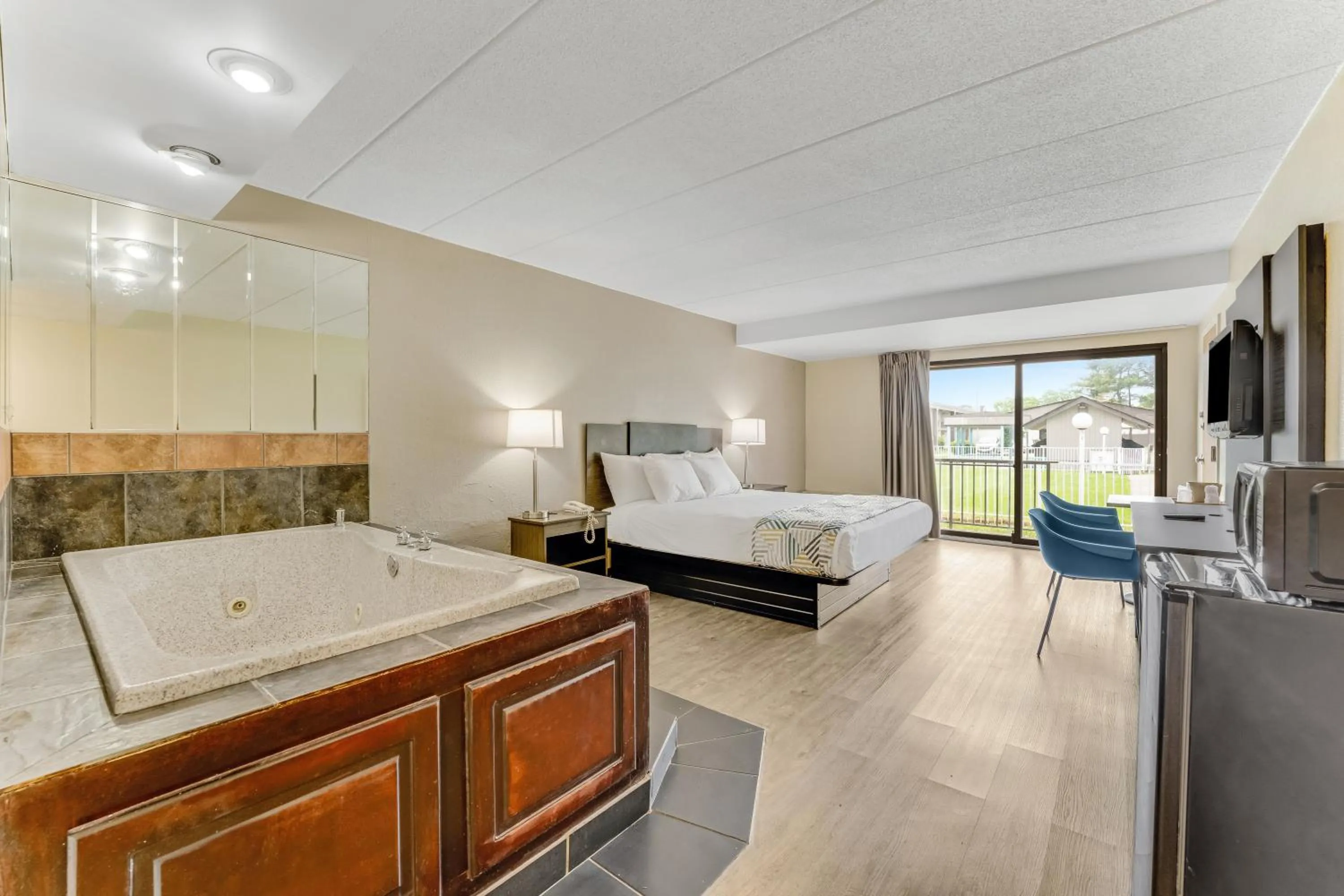 Bed in Red Carpet Inn & Suites