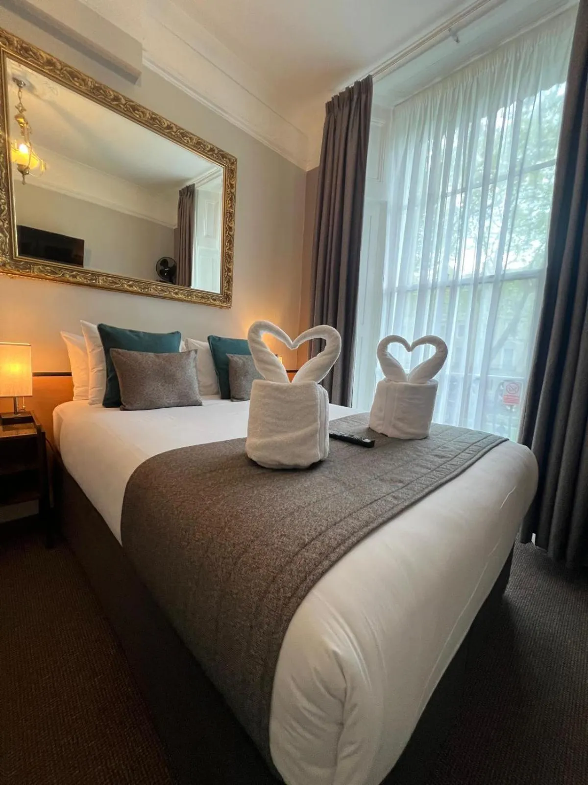 Bed in Tudor Court Hotel